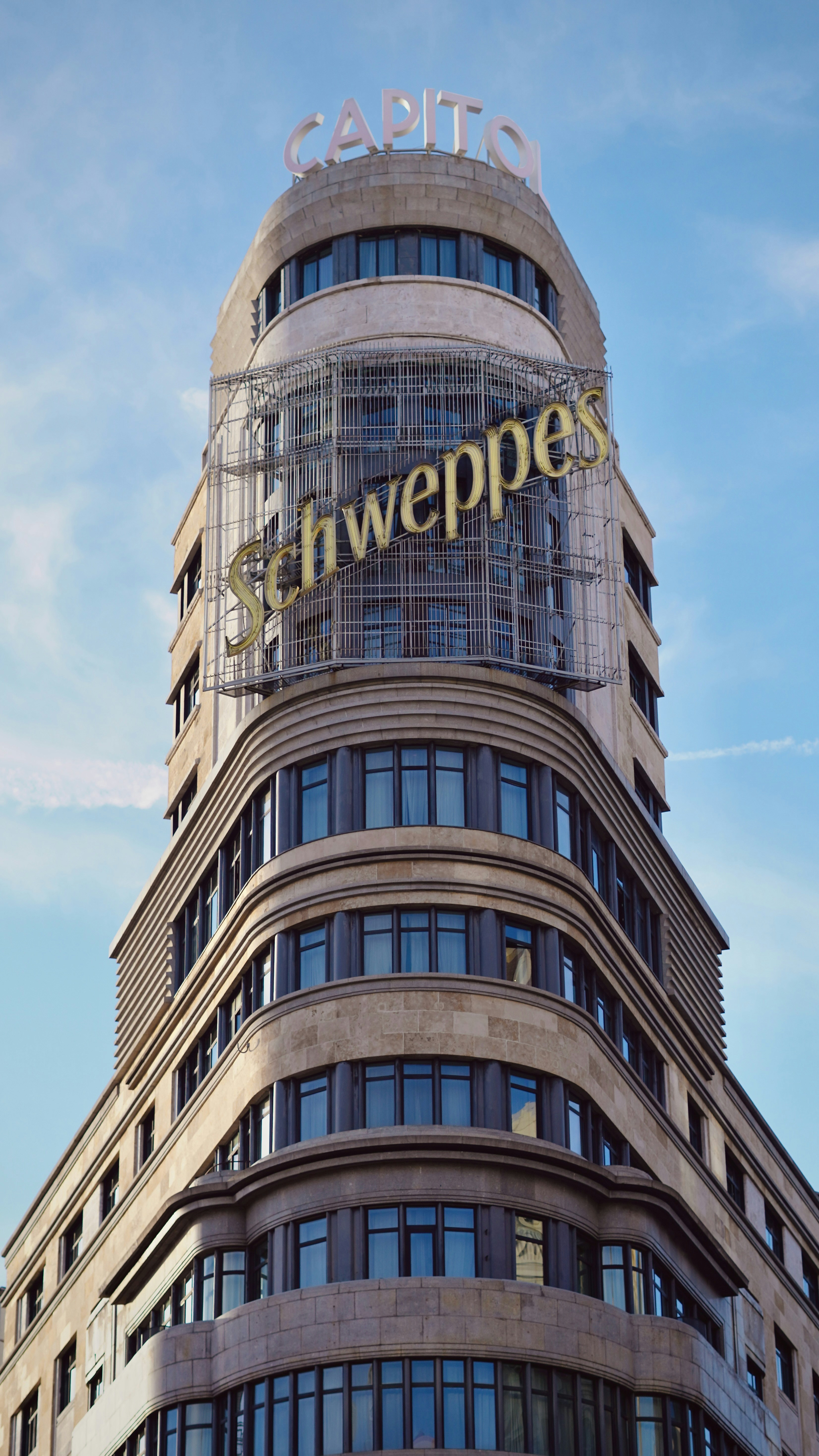 Capitol building with schweppes sign against blue sky