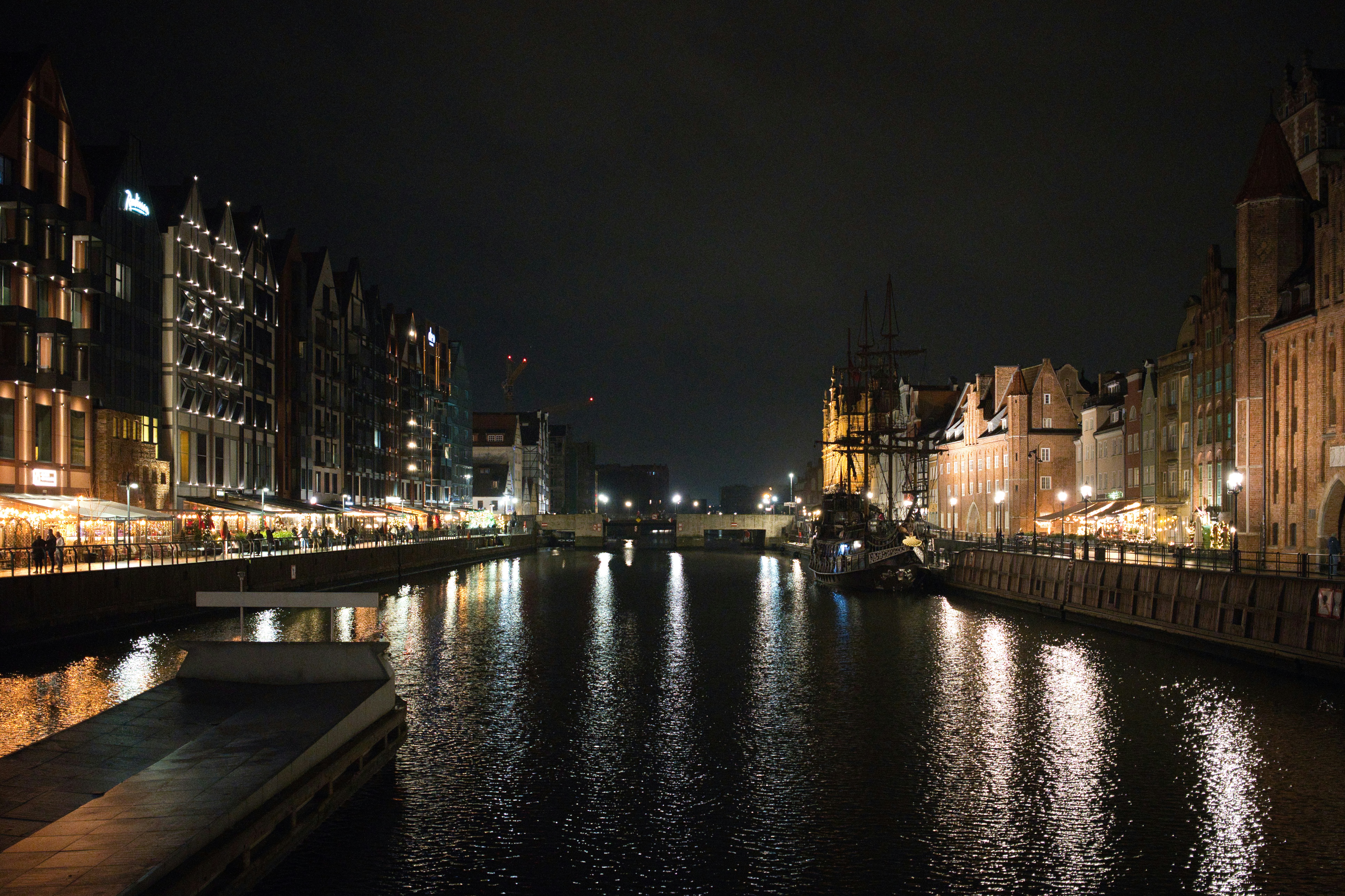 City canal at night with illuminated buildings