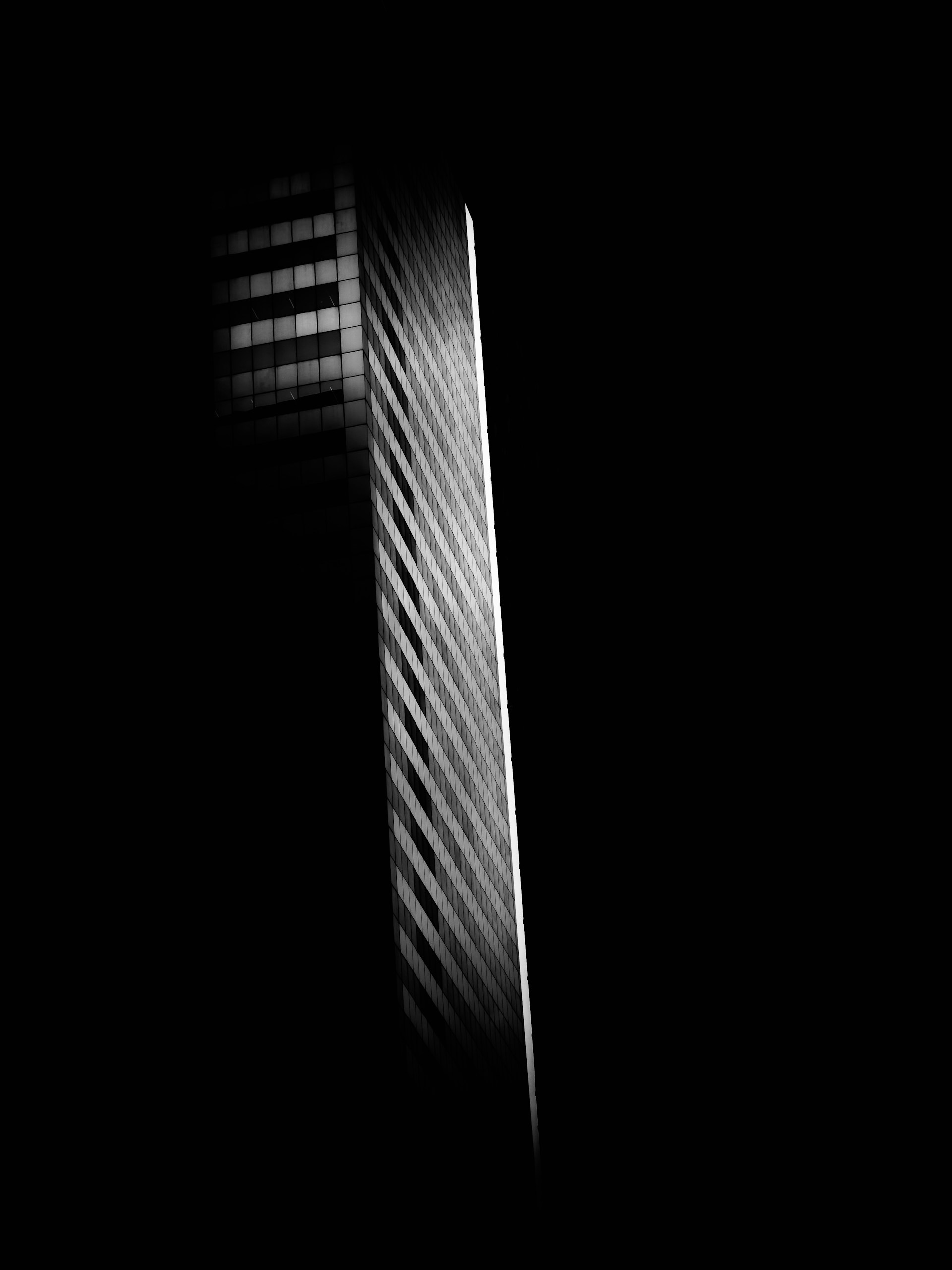 Modern skyscraper facade with diagonal lines