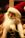 A festive santa claus figure with a long white beard.