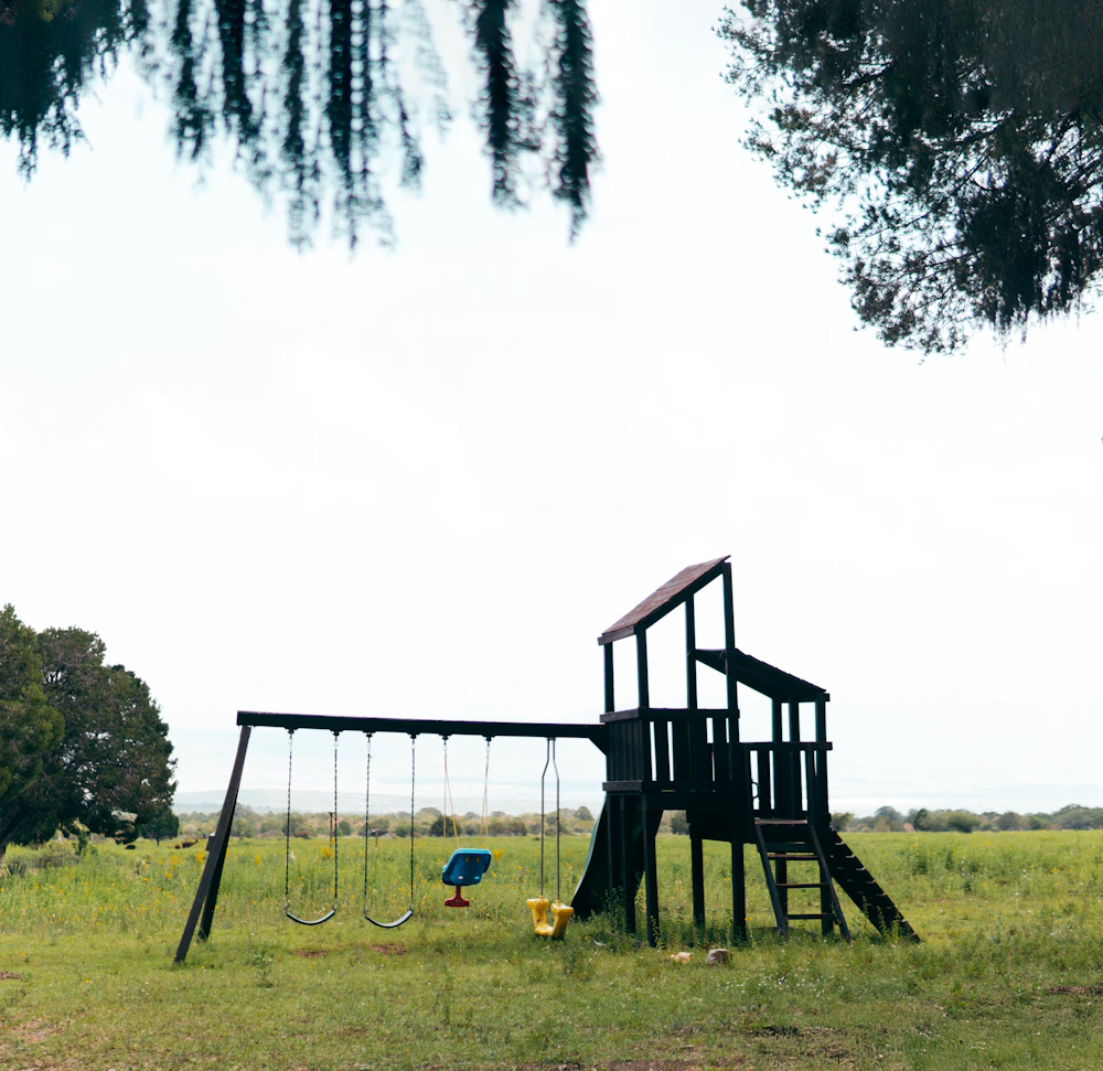 Timber play area in an open green space