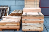 Stacks of wooden crates and pallets outdoors