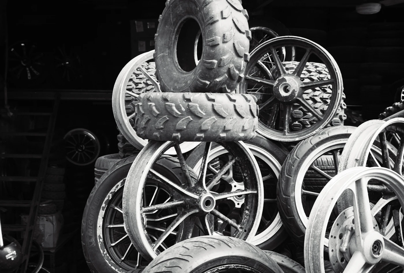 Stacked tires and wheels, representative of premium tire supply