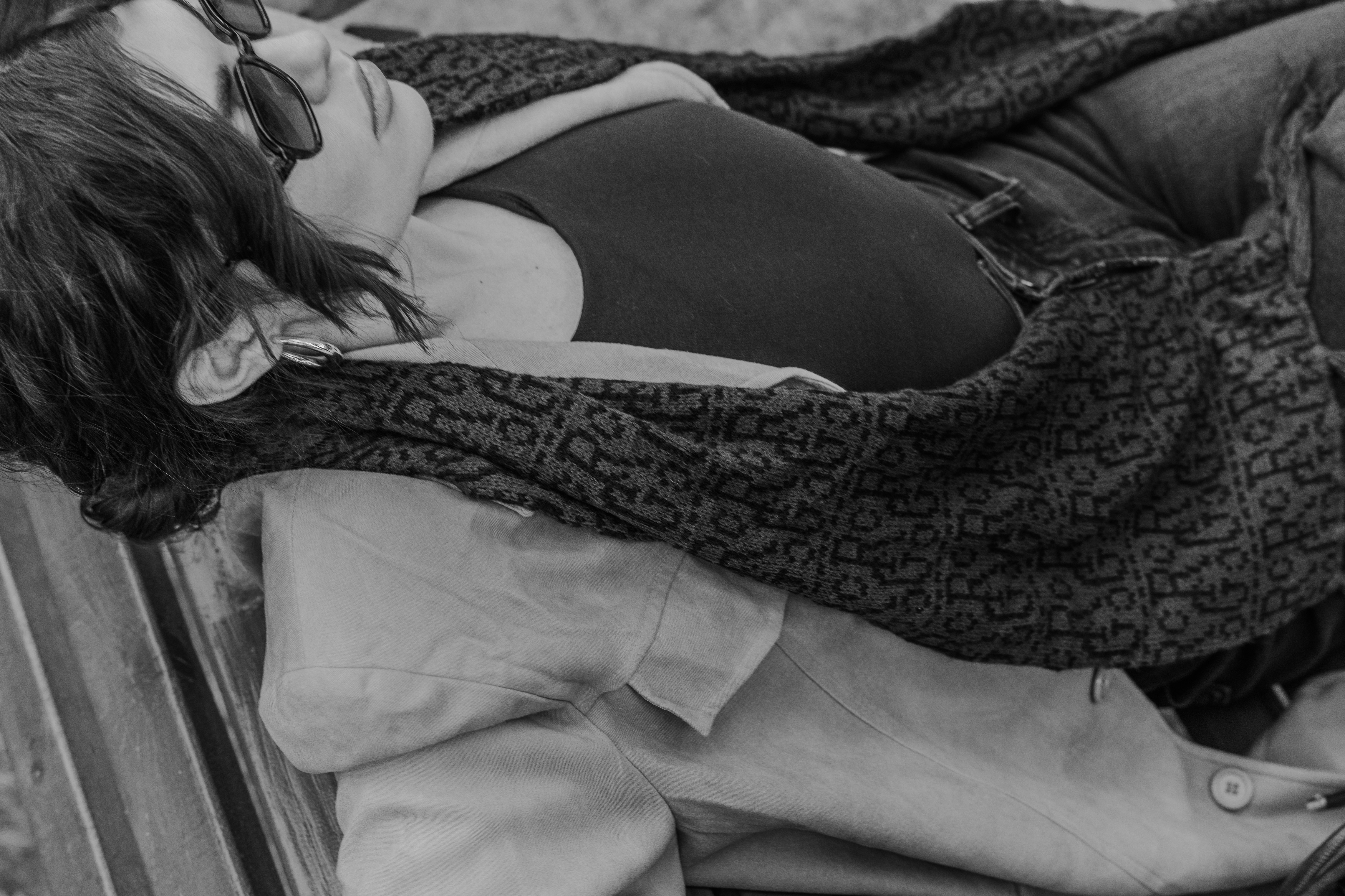 Couple relaxing together outdoors in black and white.