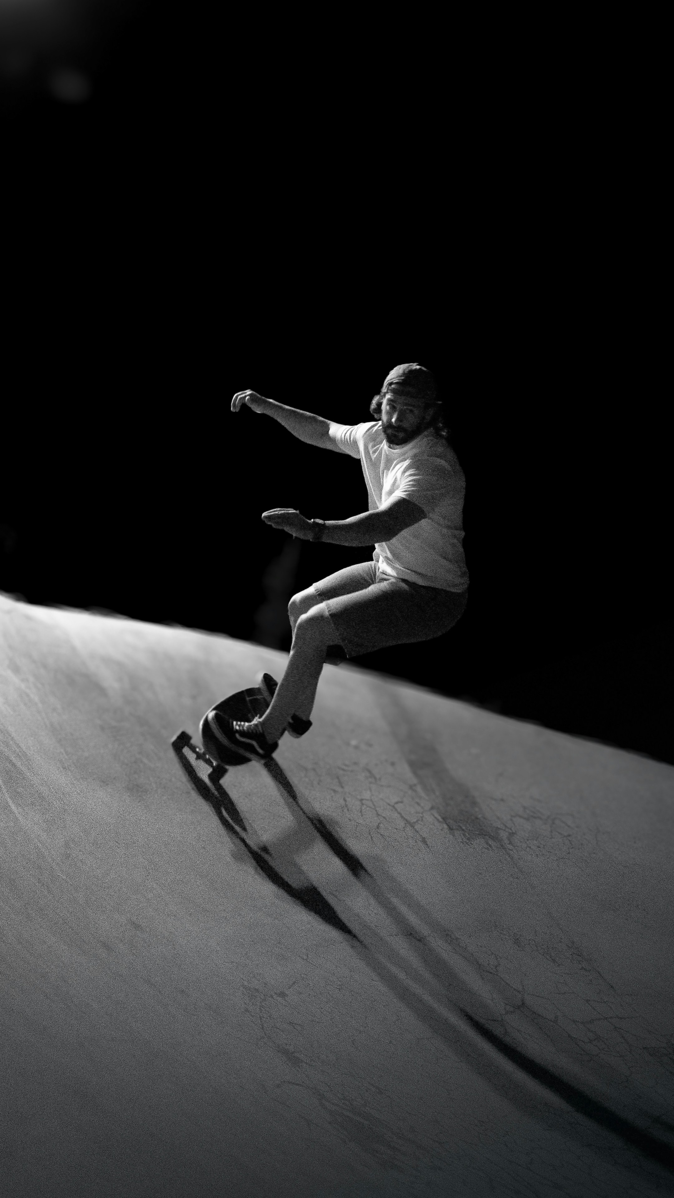Man skateboarding on a ramp at night