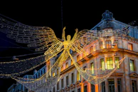 Golden angel illuminated with christmas lights