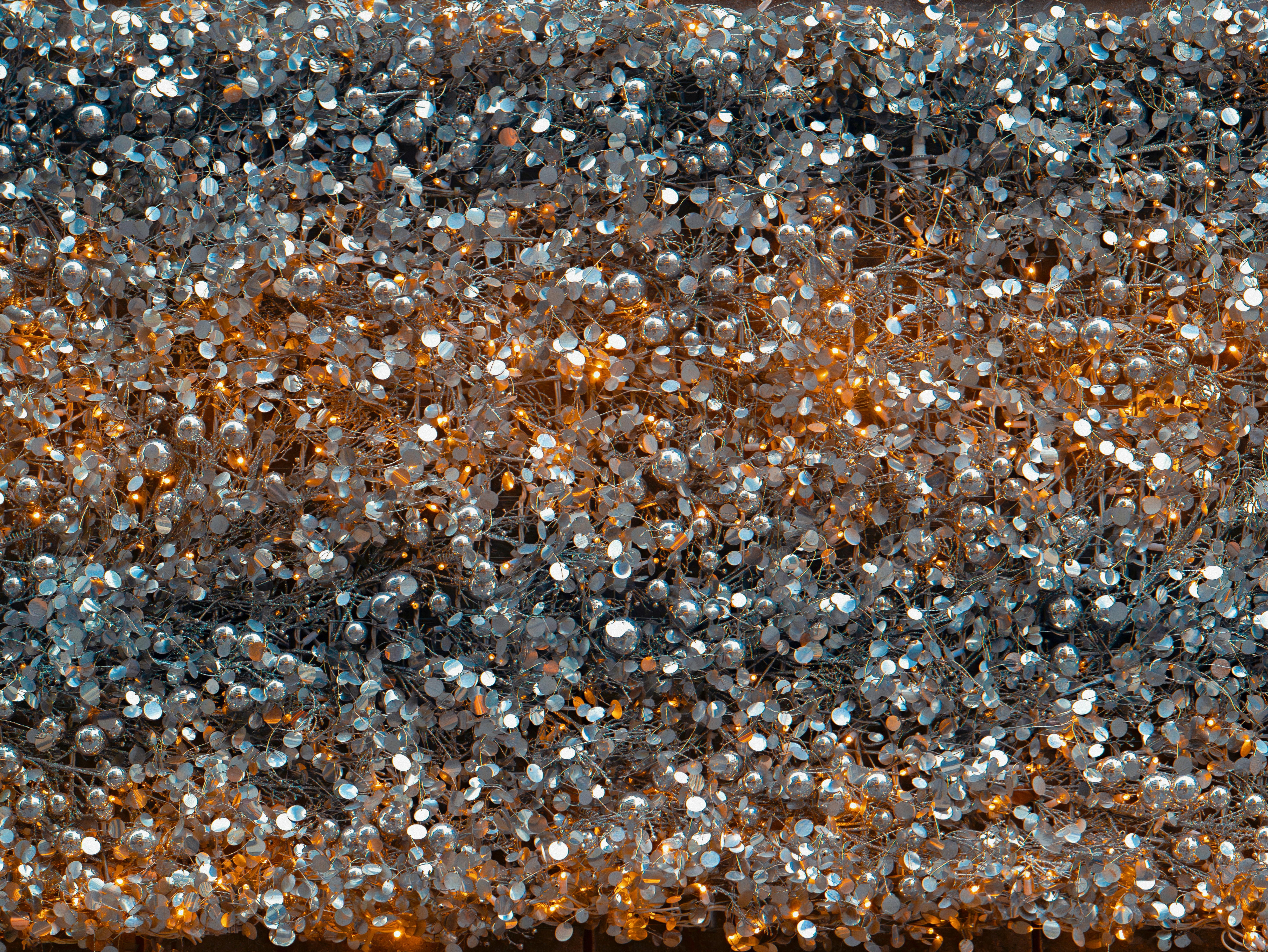 Close-up of shimmering silver and orange lights.