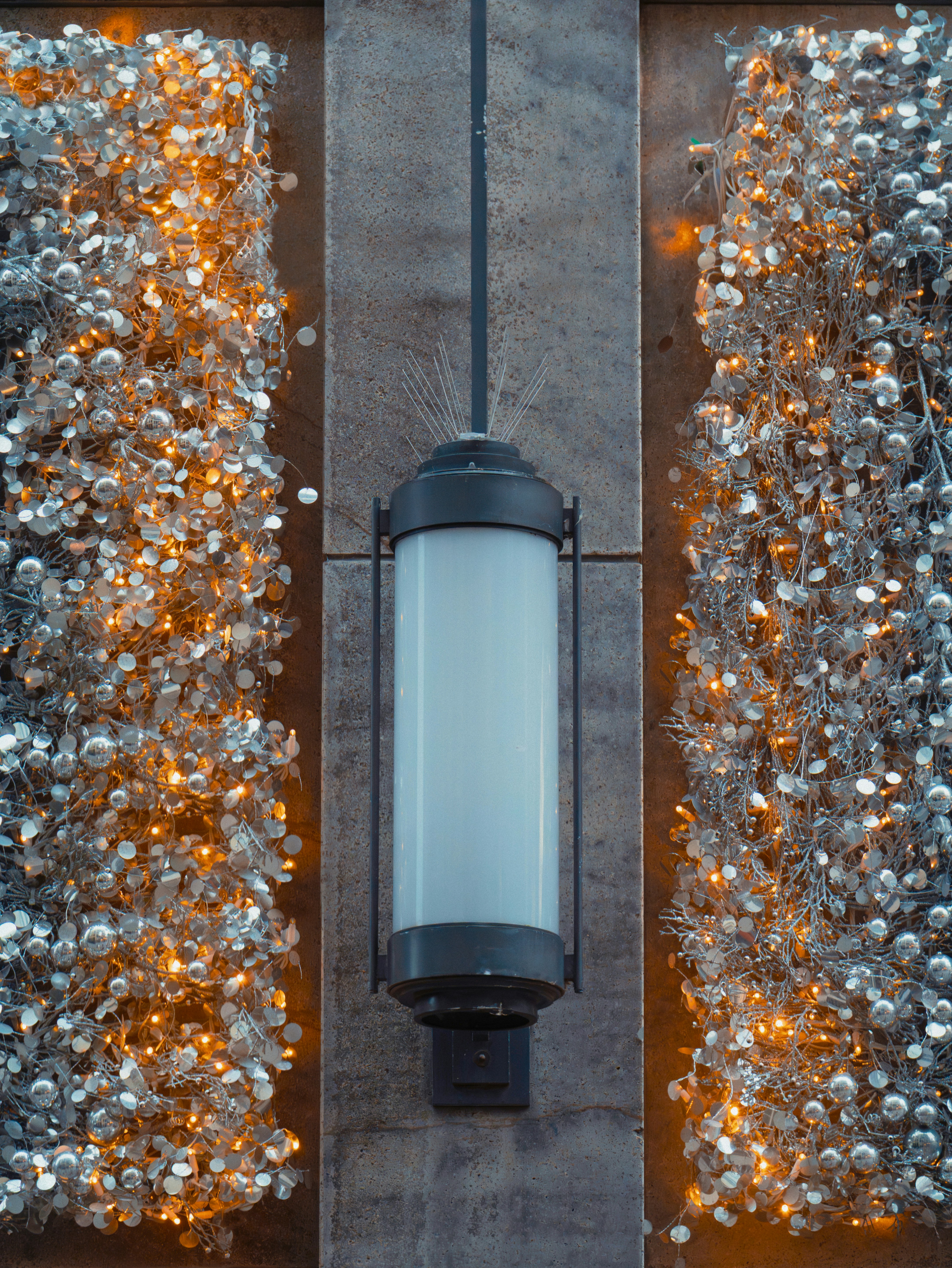 A modern lantern with decorative lights on sides