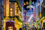 Carnaby street illuminated with festive lights at night
