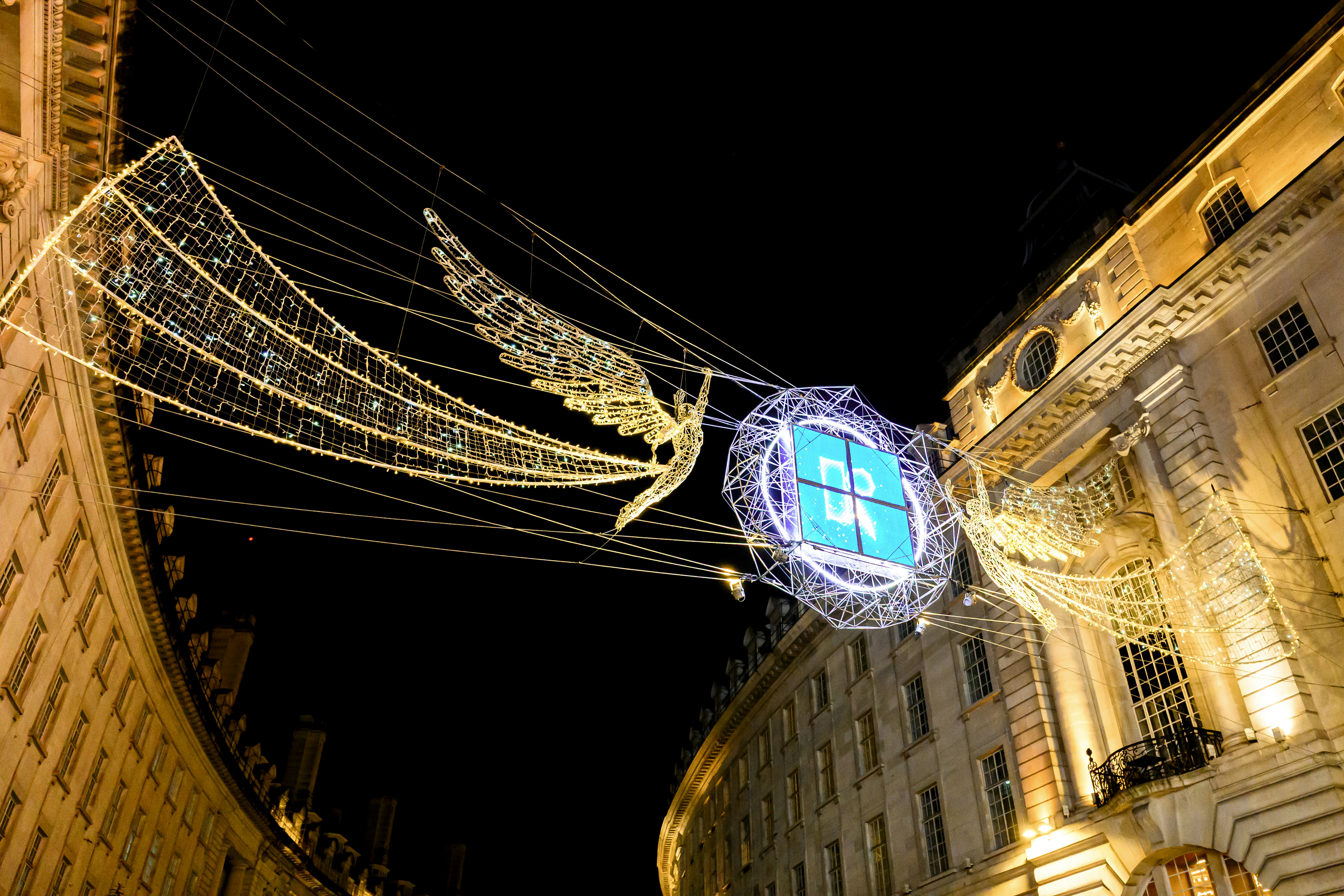 Angel decoration with lights on a street at night