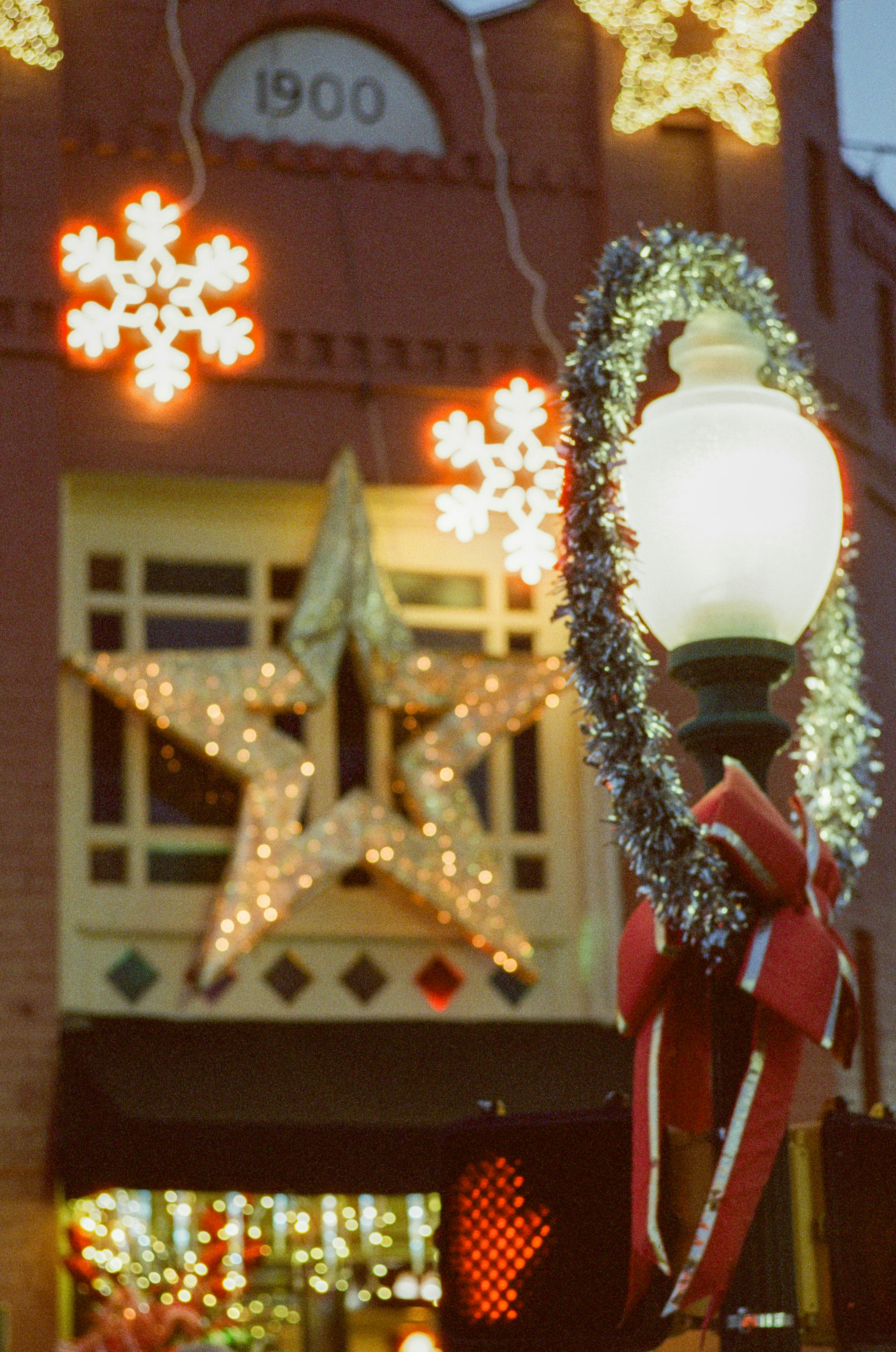 Building decorated with festive christmas lights and garlands.
