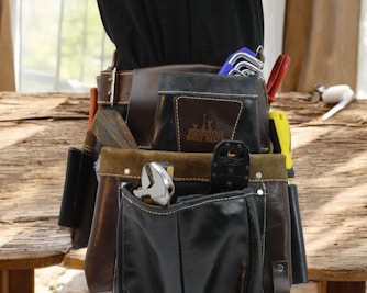 Tool belt filled with various hand tools