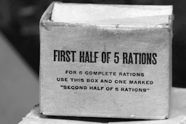 Cardboard box labeled "first half of 5 rations"