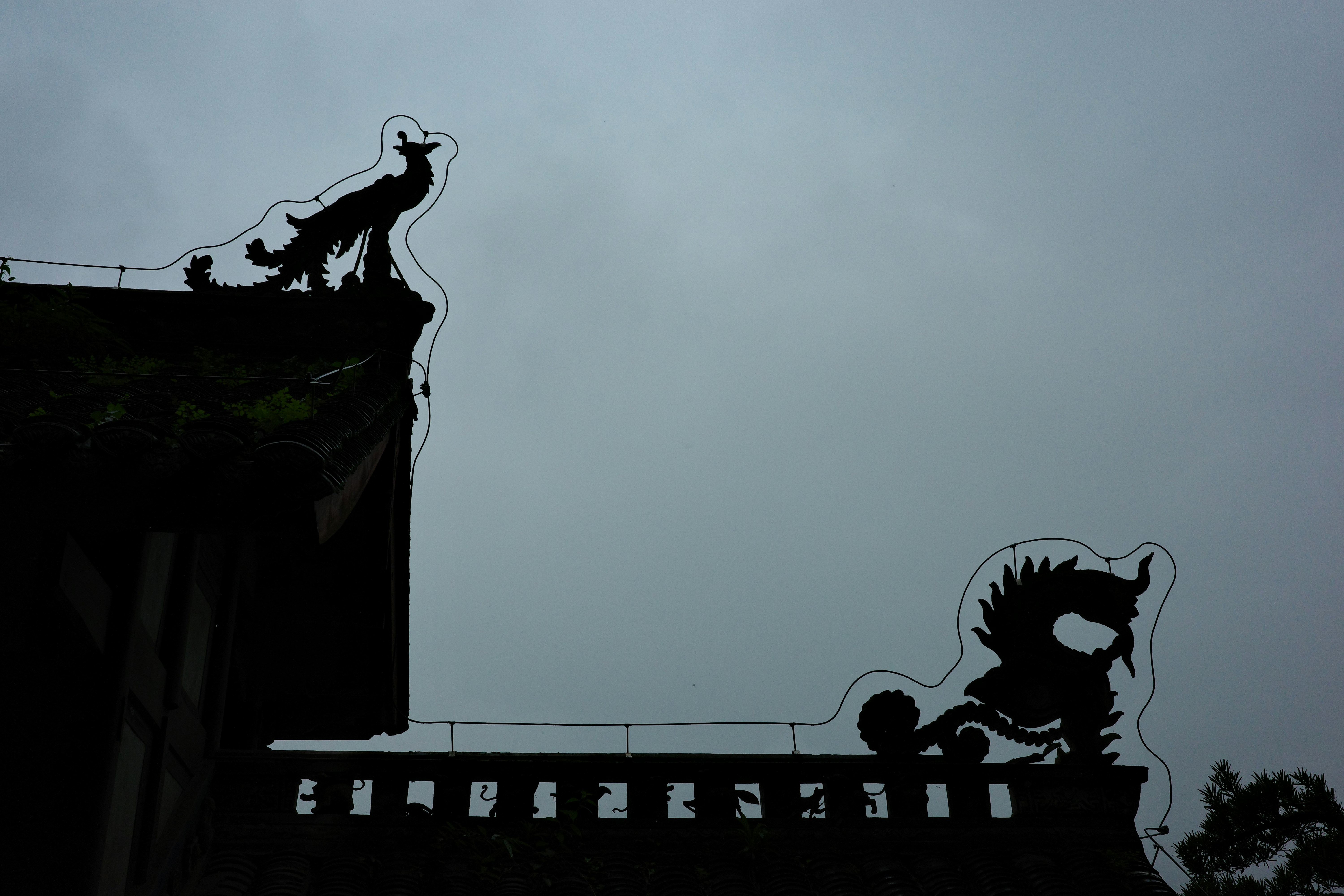 Silhouettes of mythical creatures on a building