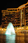 Wynn palace hotel with illuminated fountain at night