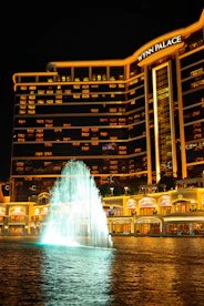 Wynn palace hotel with illuminated fountain at night