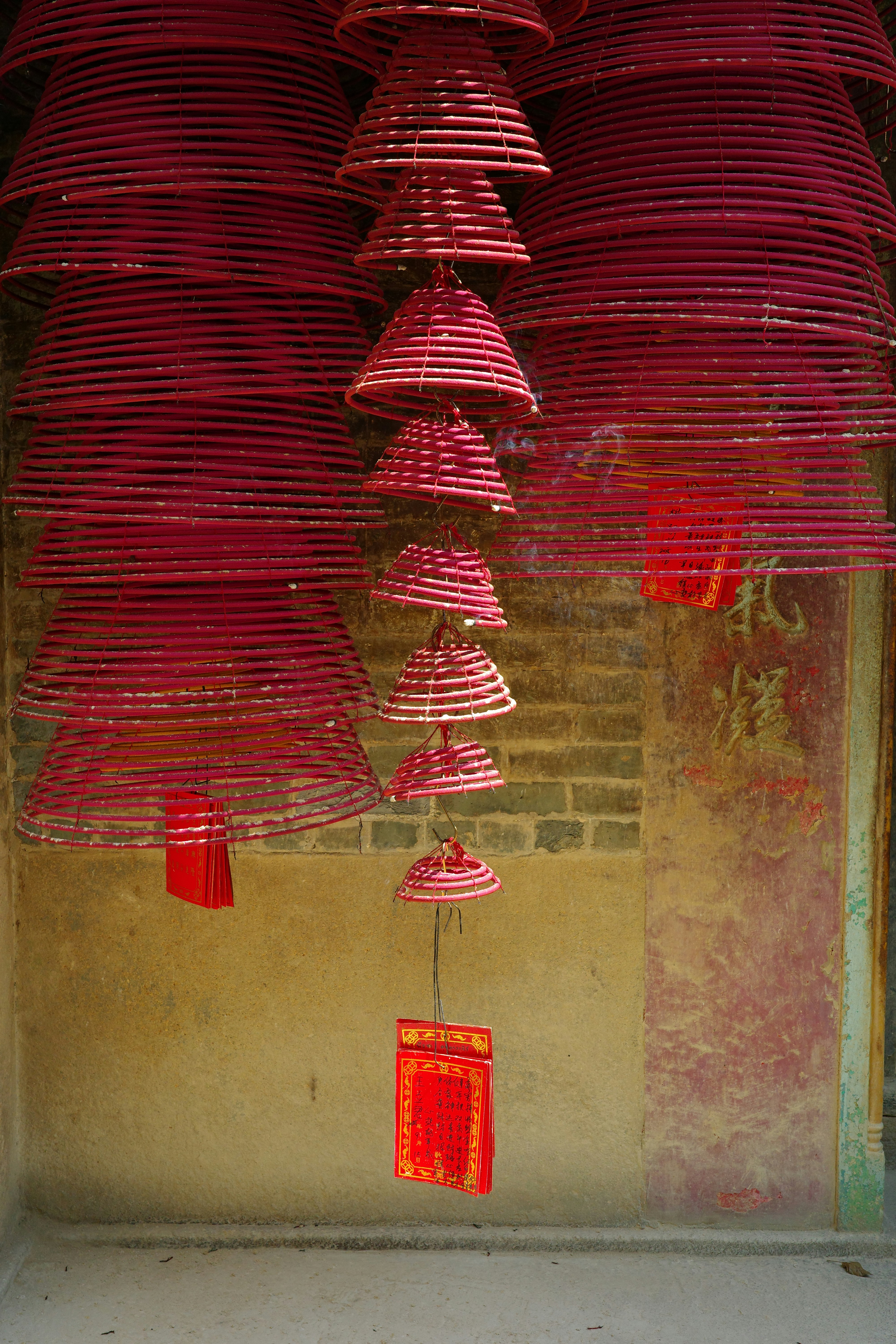 Hanging red incense coils in a temple