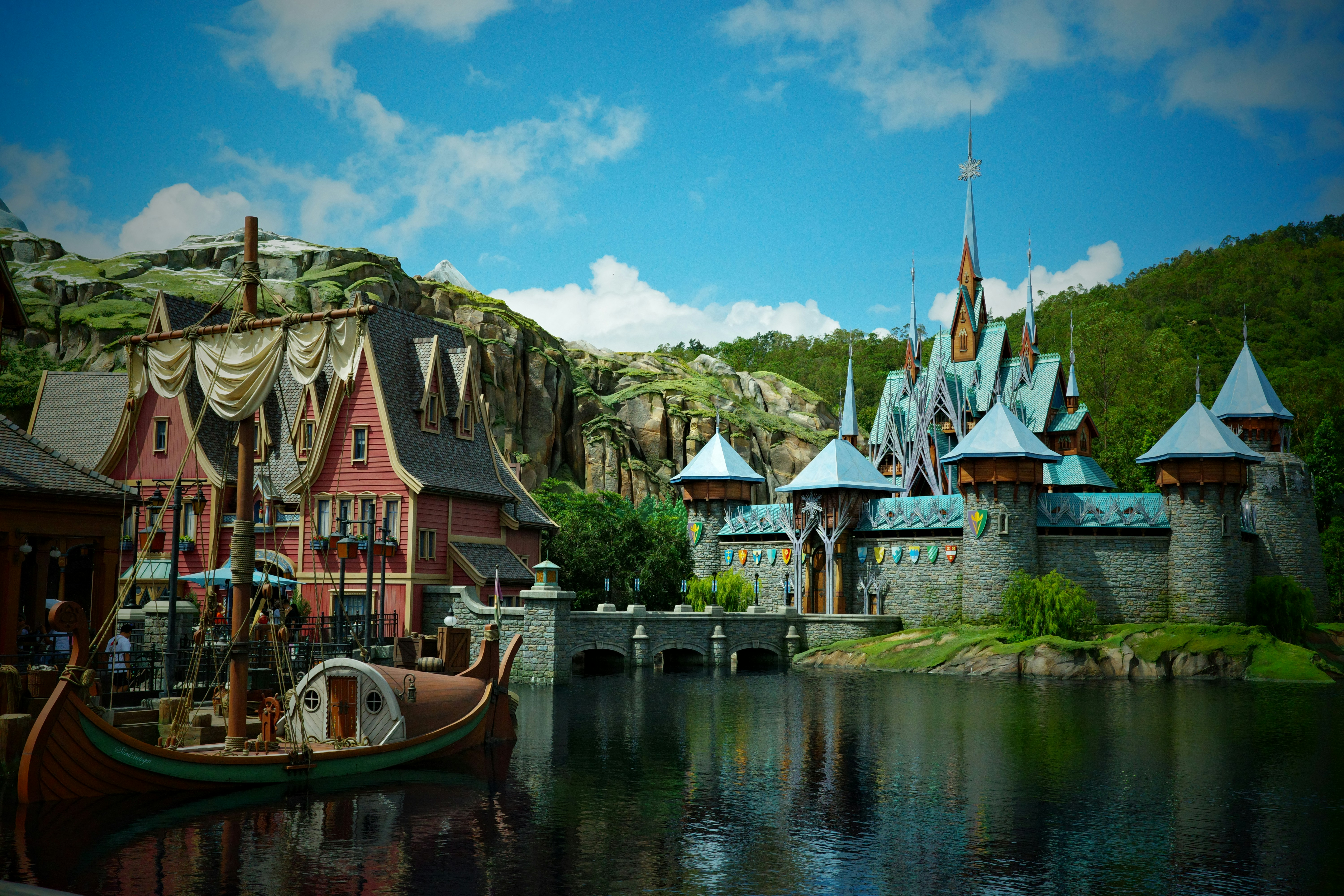 Castle and village on a lake with a boat