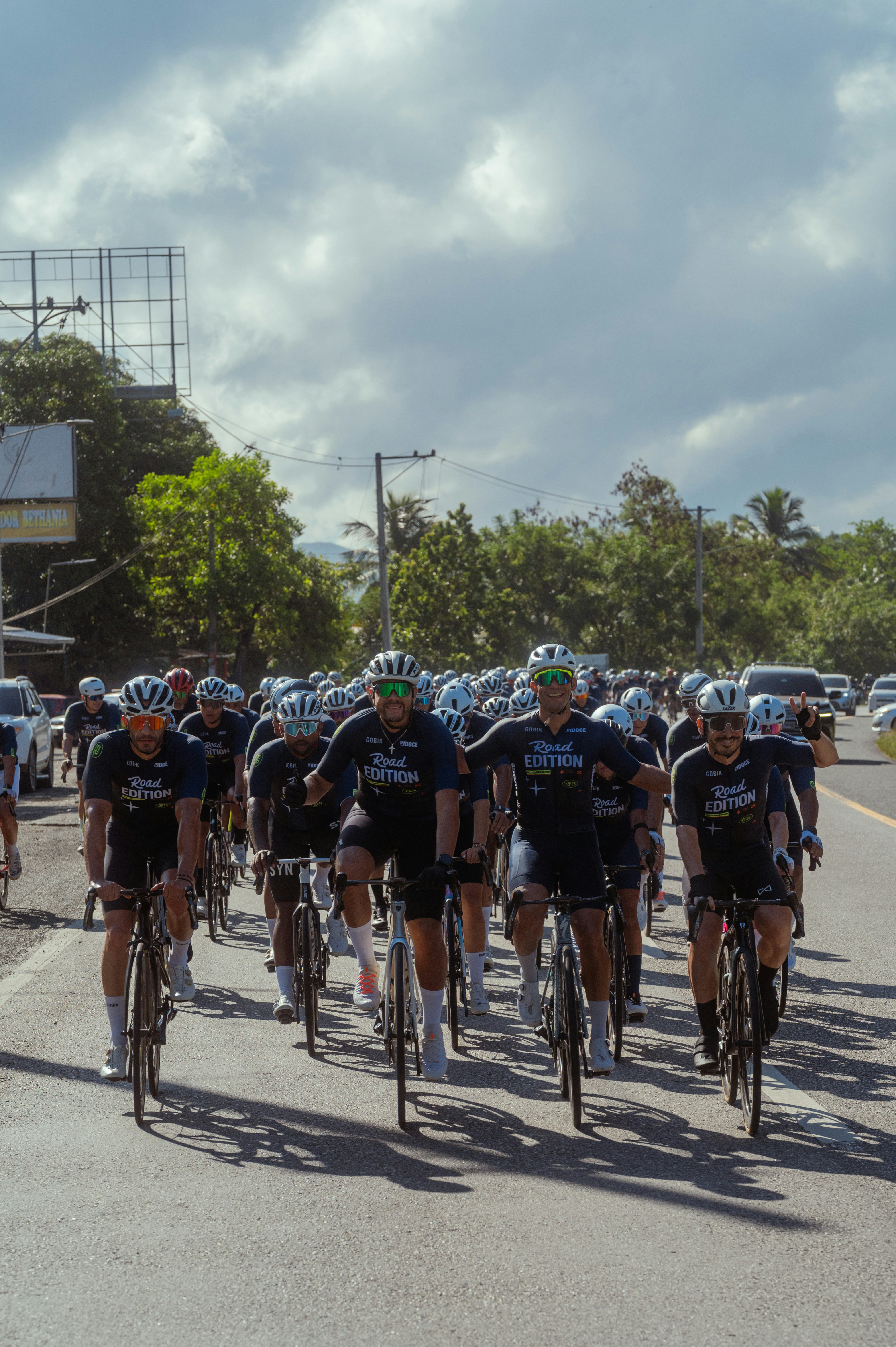 Group of cyclists riding on a road