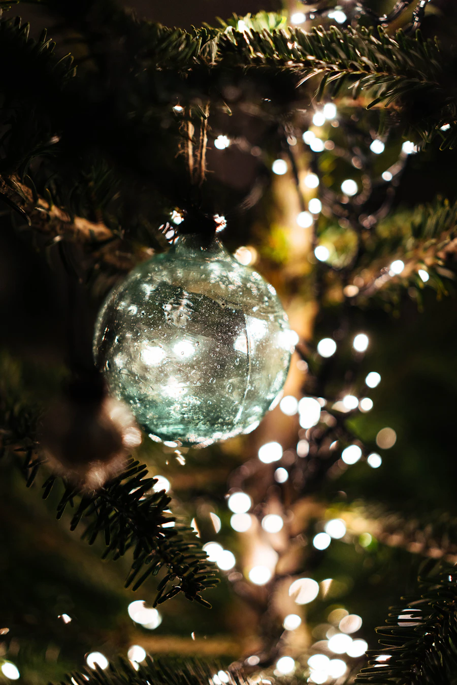 A hand-blown glass Christmas ornament from a named workshop