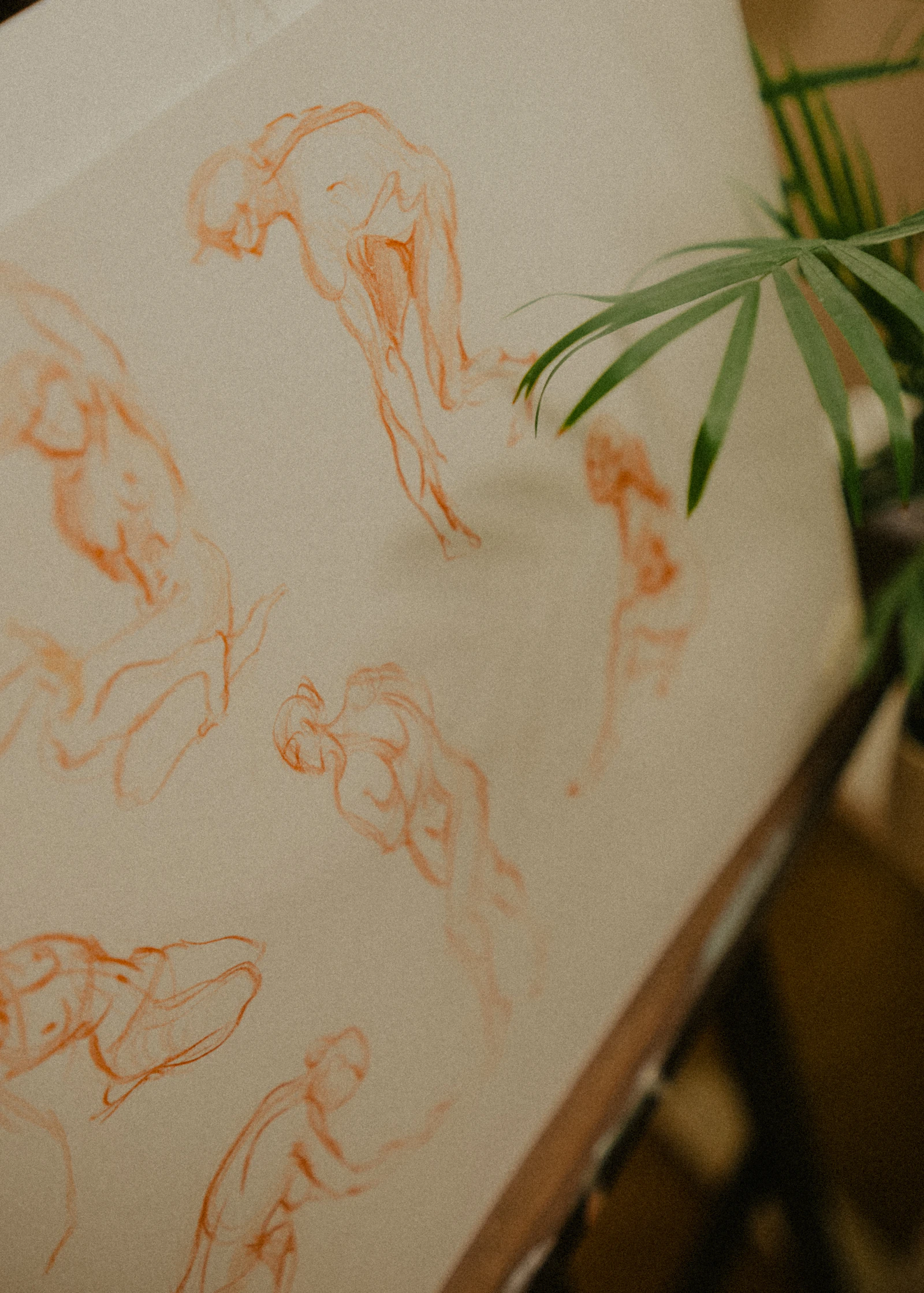 Sketches of human figures on paper