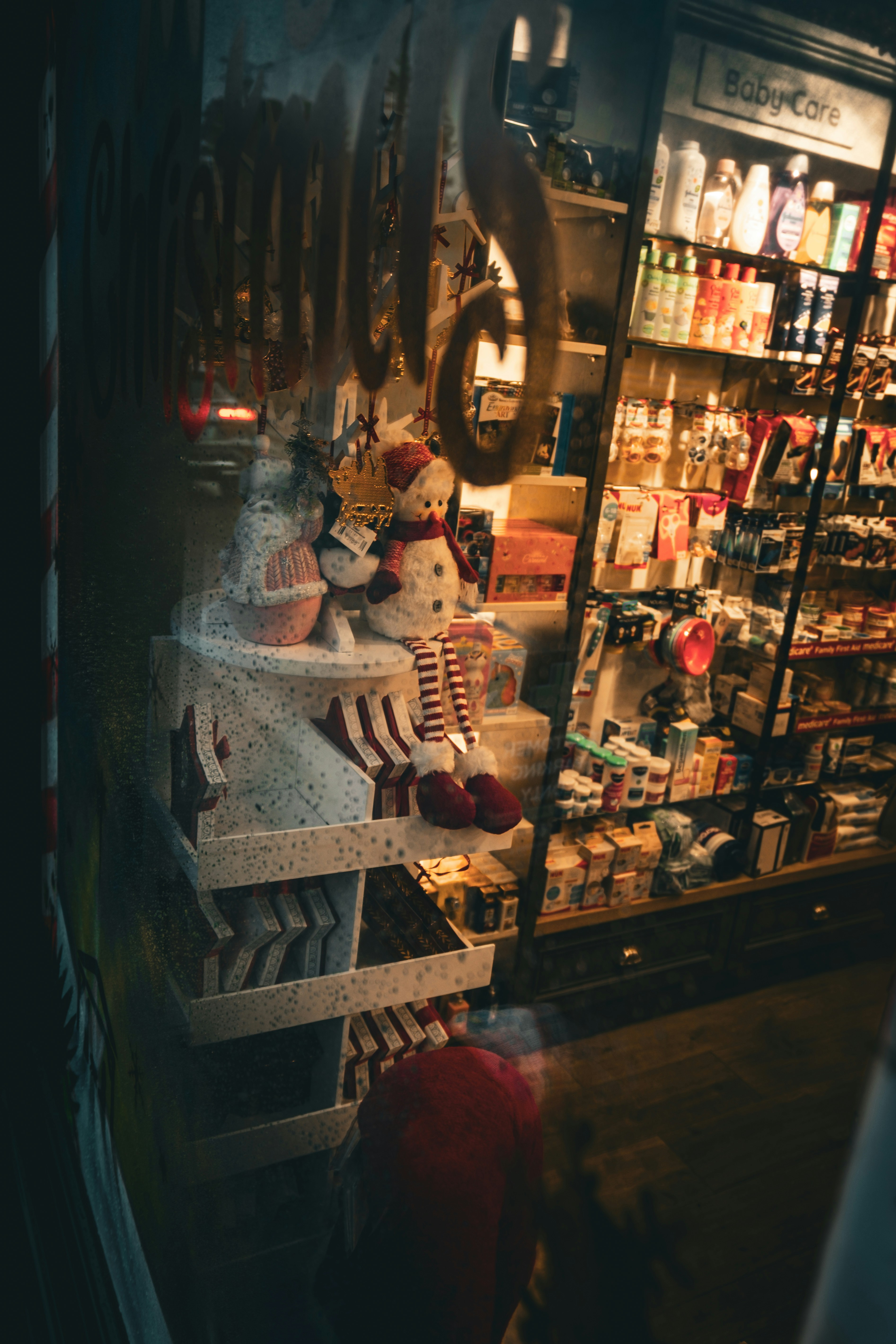 Christmas decorations displayed in a store window.
