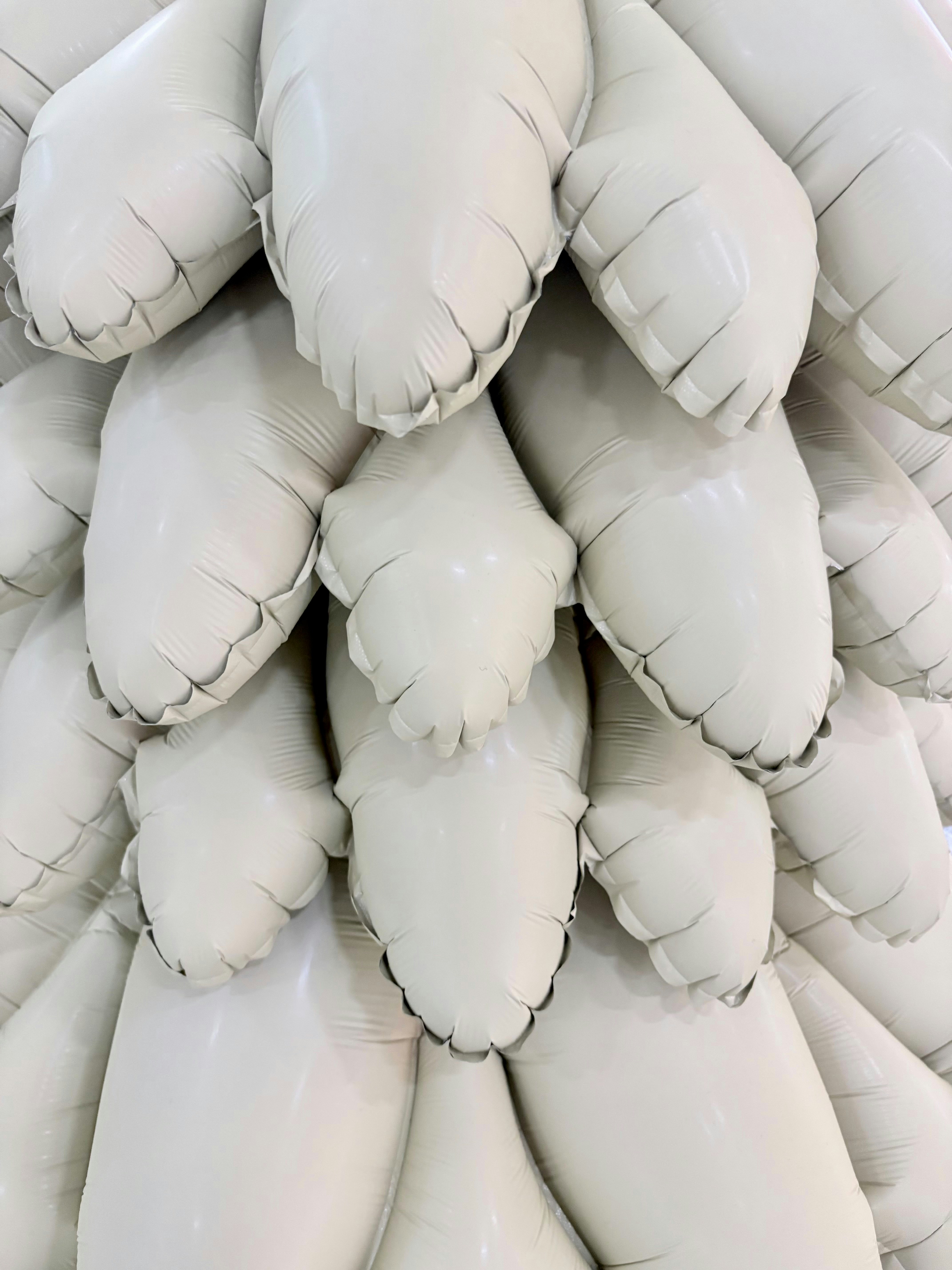 A close-up of a cluster of white inflatable objects.