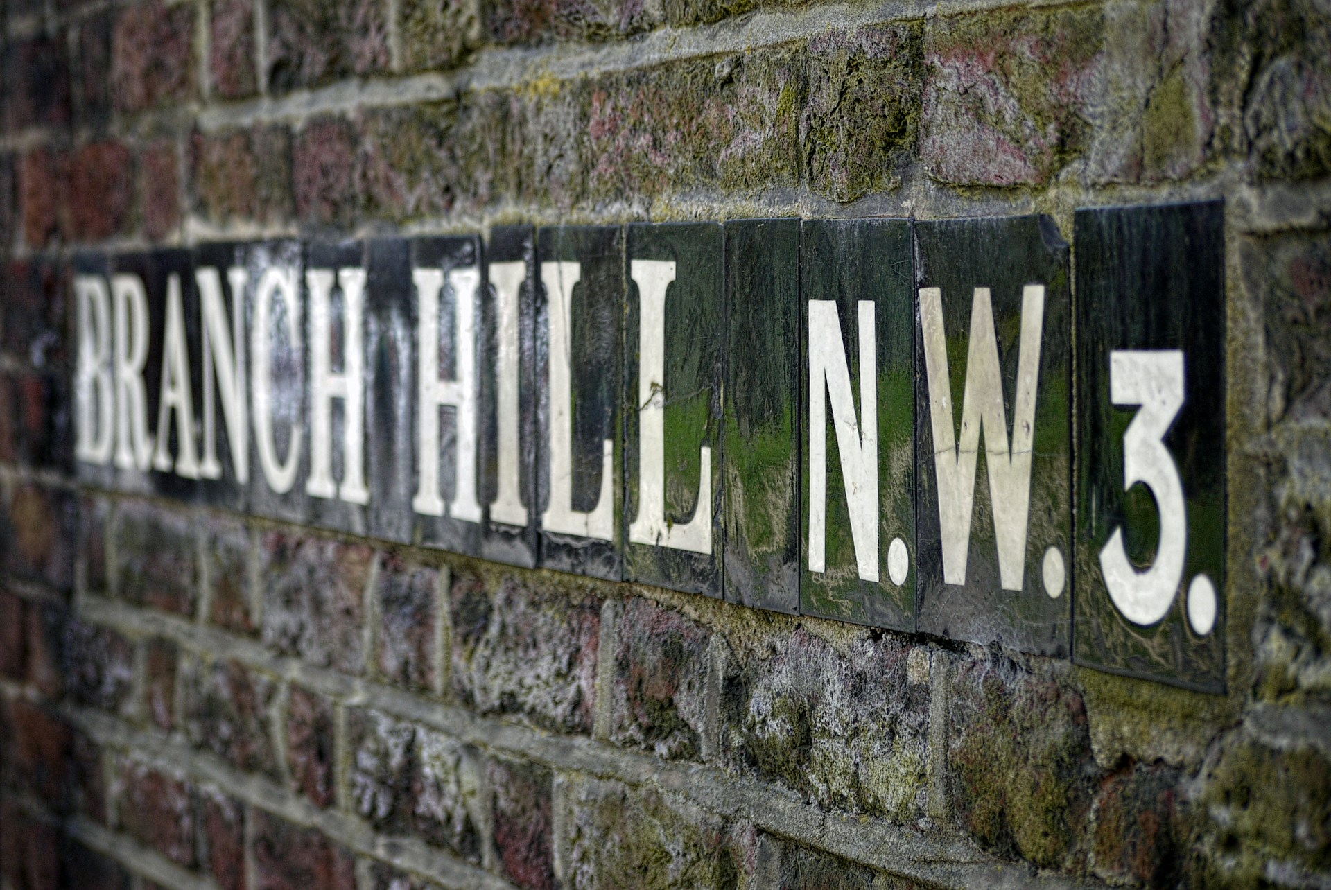 Branch hill n.w.3 street sign on brick wall