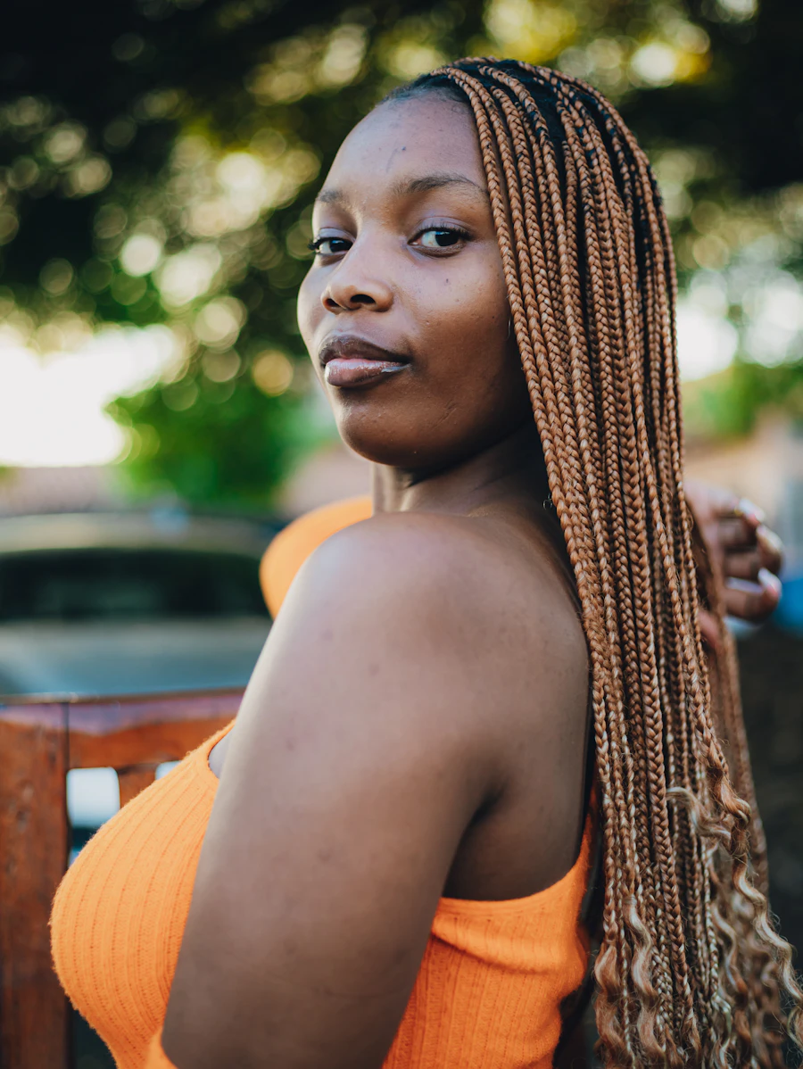 Woman wearing long honey-brown braided hair