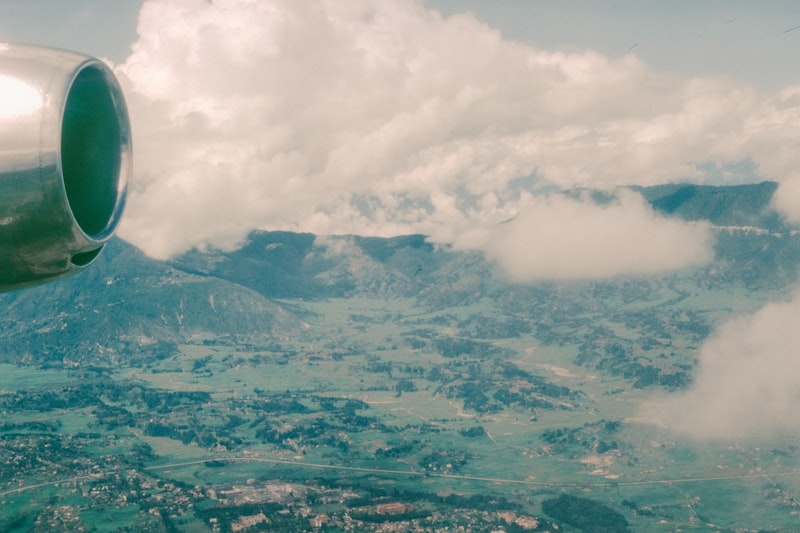 Airplane engine with mountainous landscape below