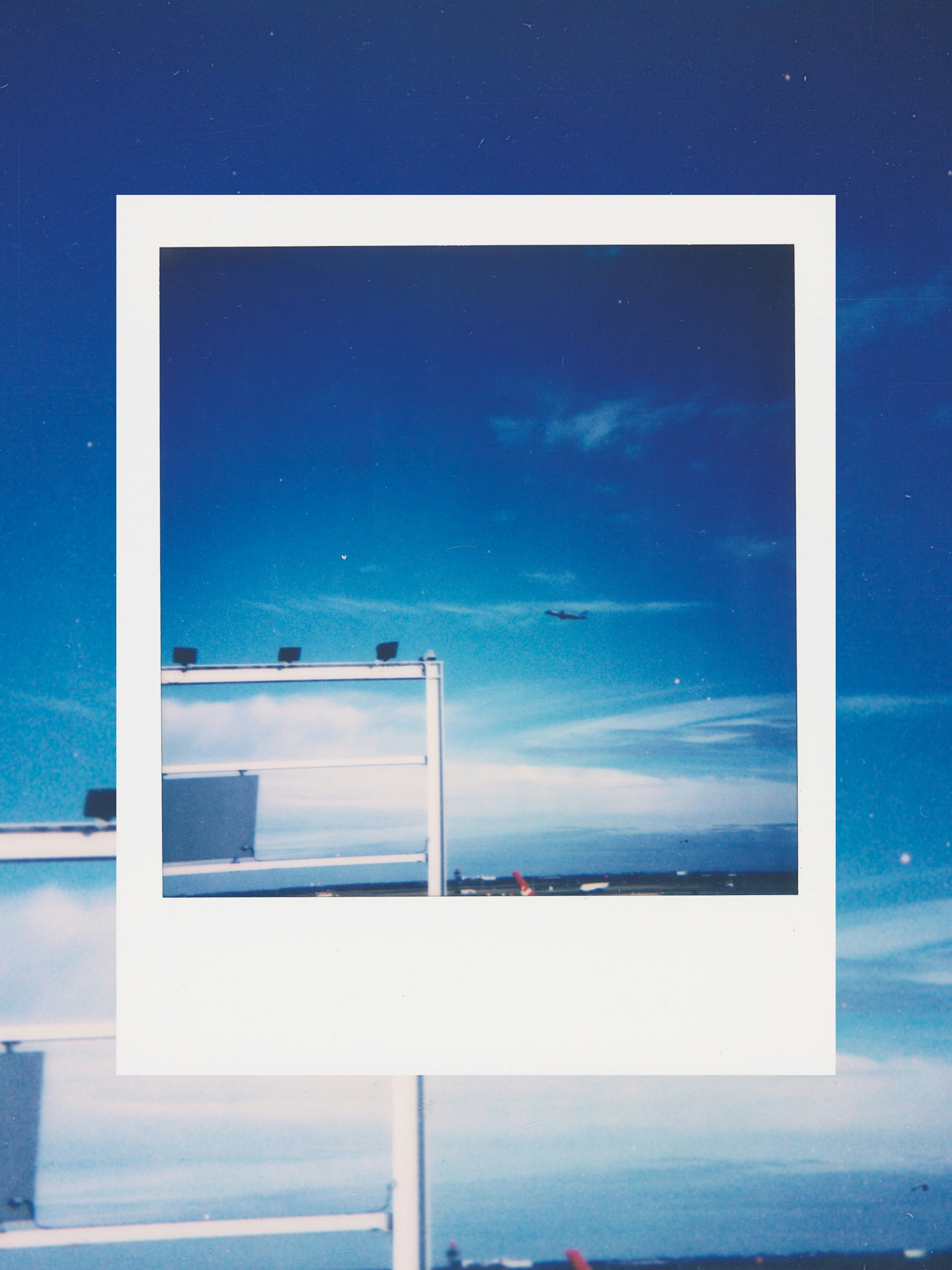 Airplane flying in a bright blue sky.