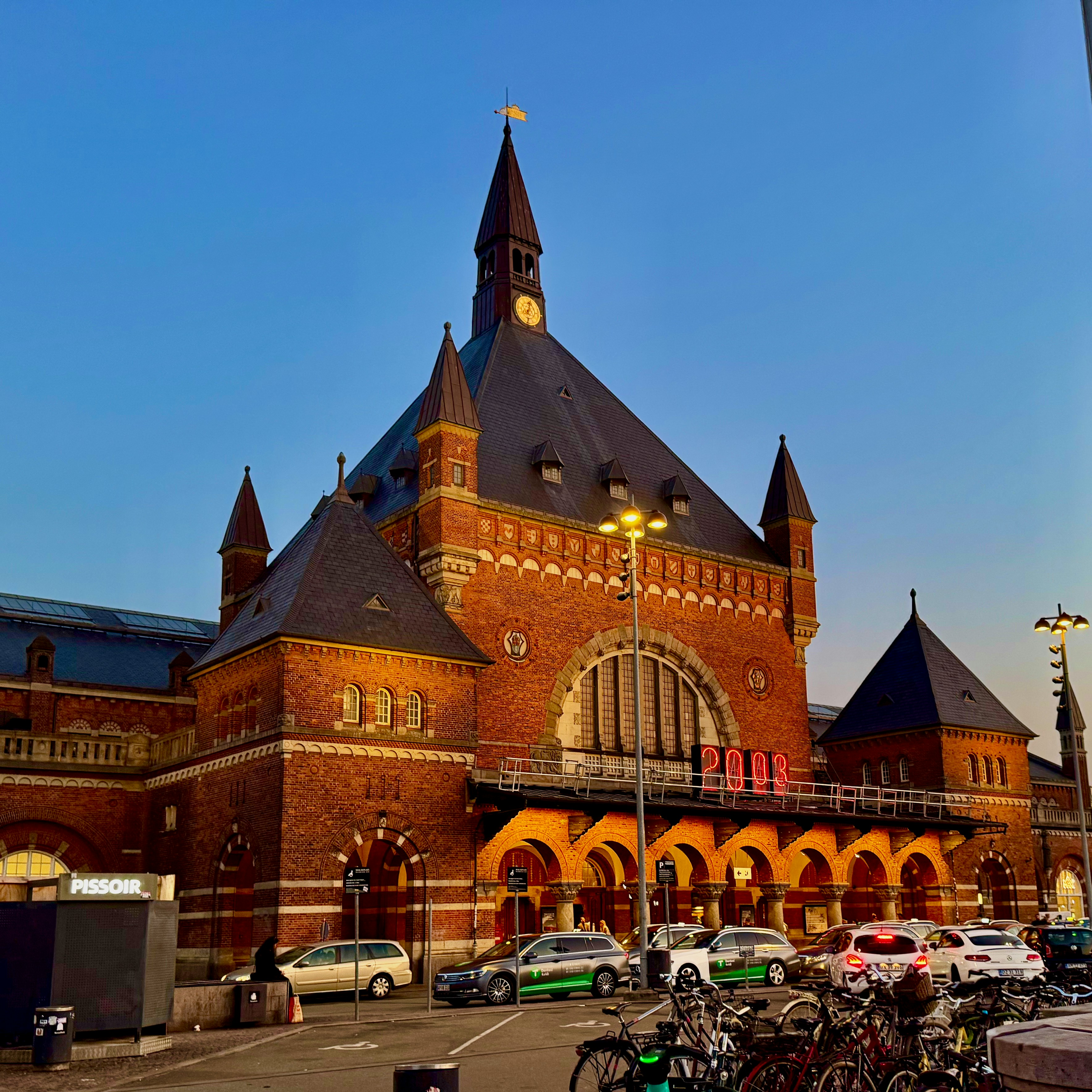 Historic brick building with arched windows and clock tower.