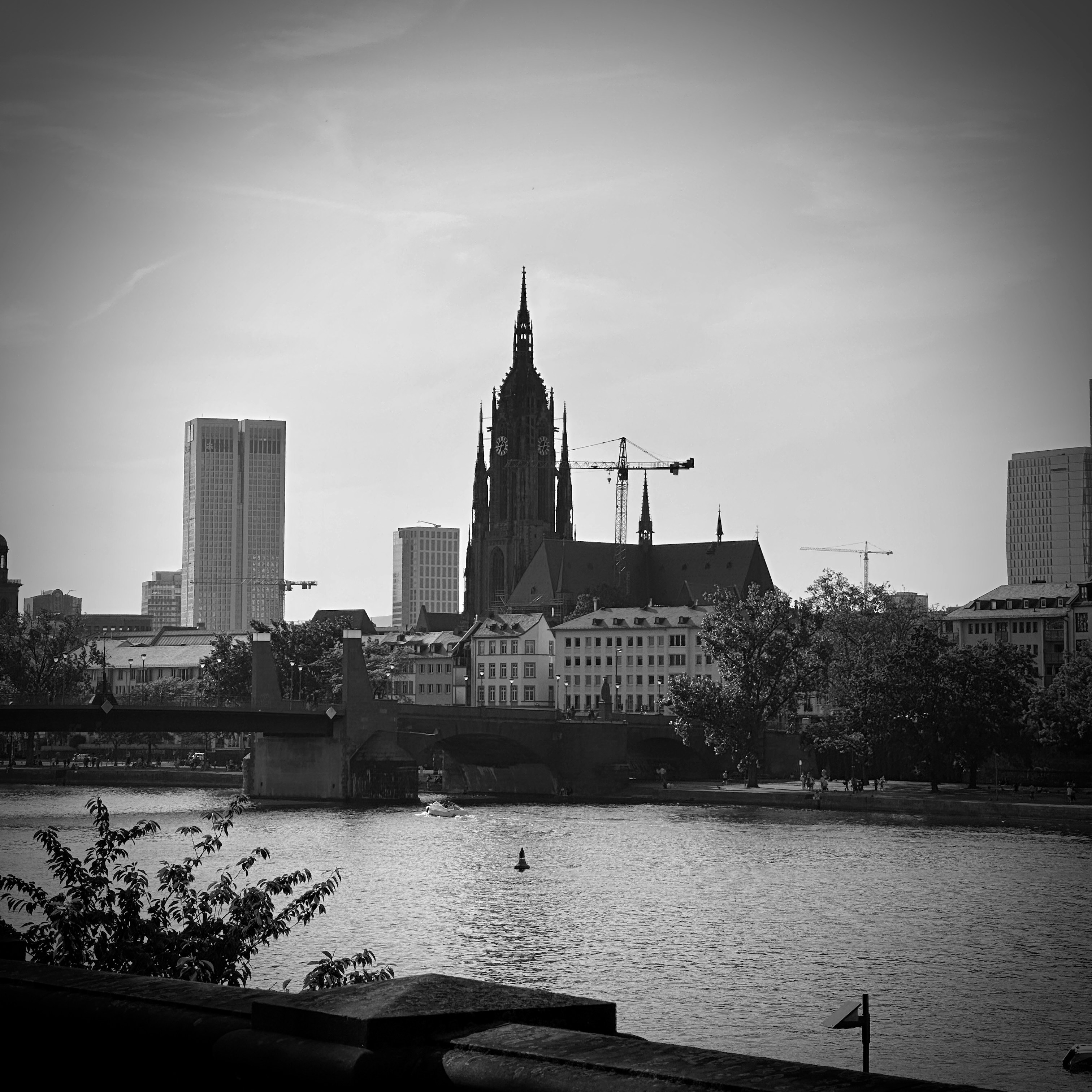 Historic church tower amidst modern city skyline