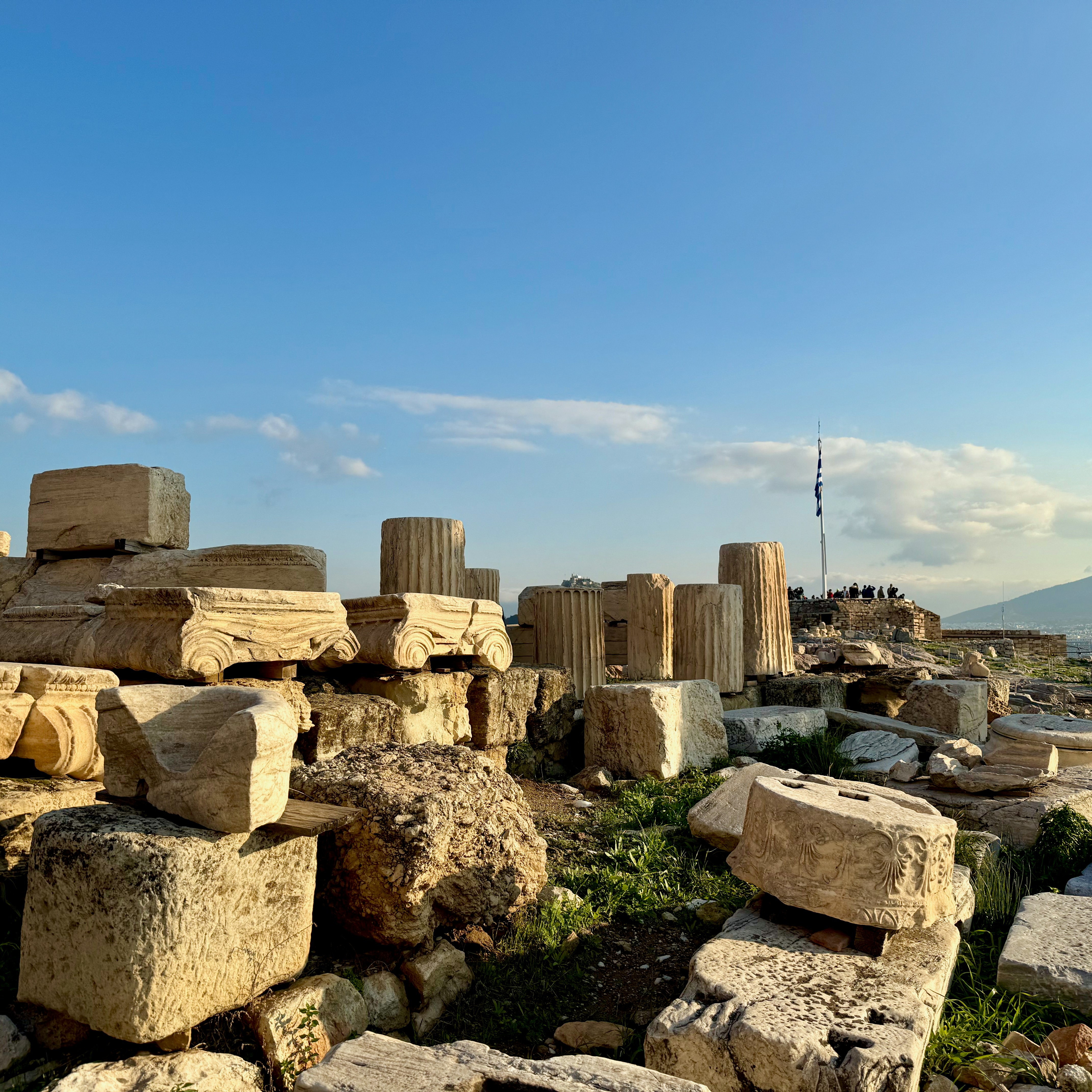 Ancient marble ruins under a clear blue sky.