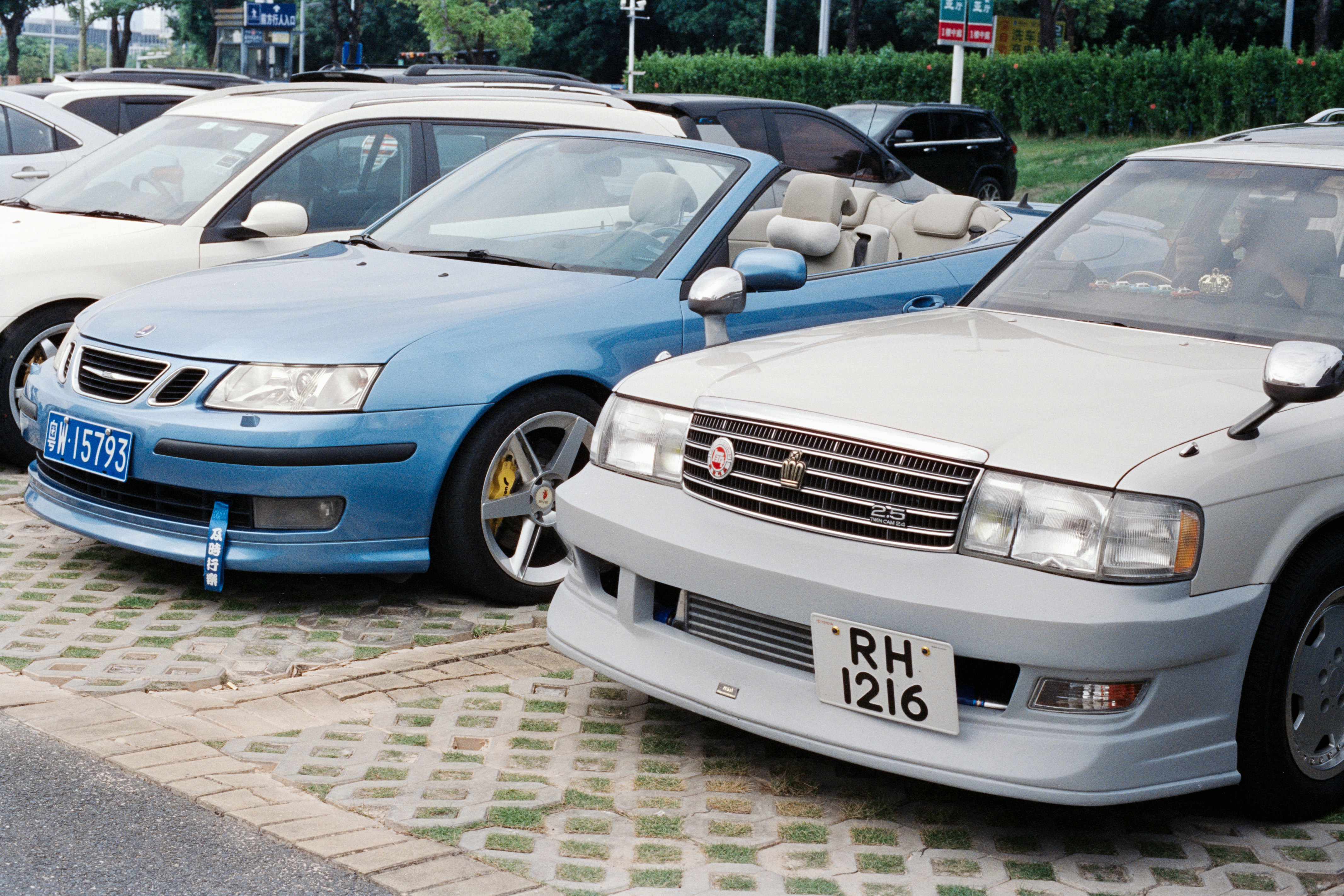 Several cars parked in a lot.