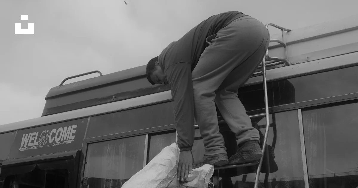 Bus Loading Man Two men loading bags onto a bus photo – Free Travel Image on Unsplash