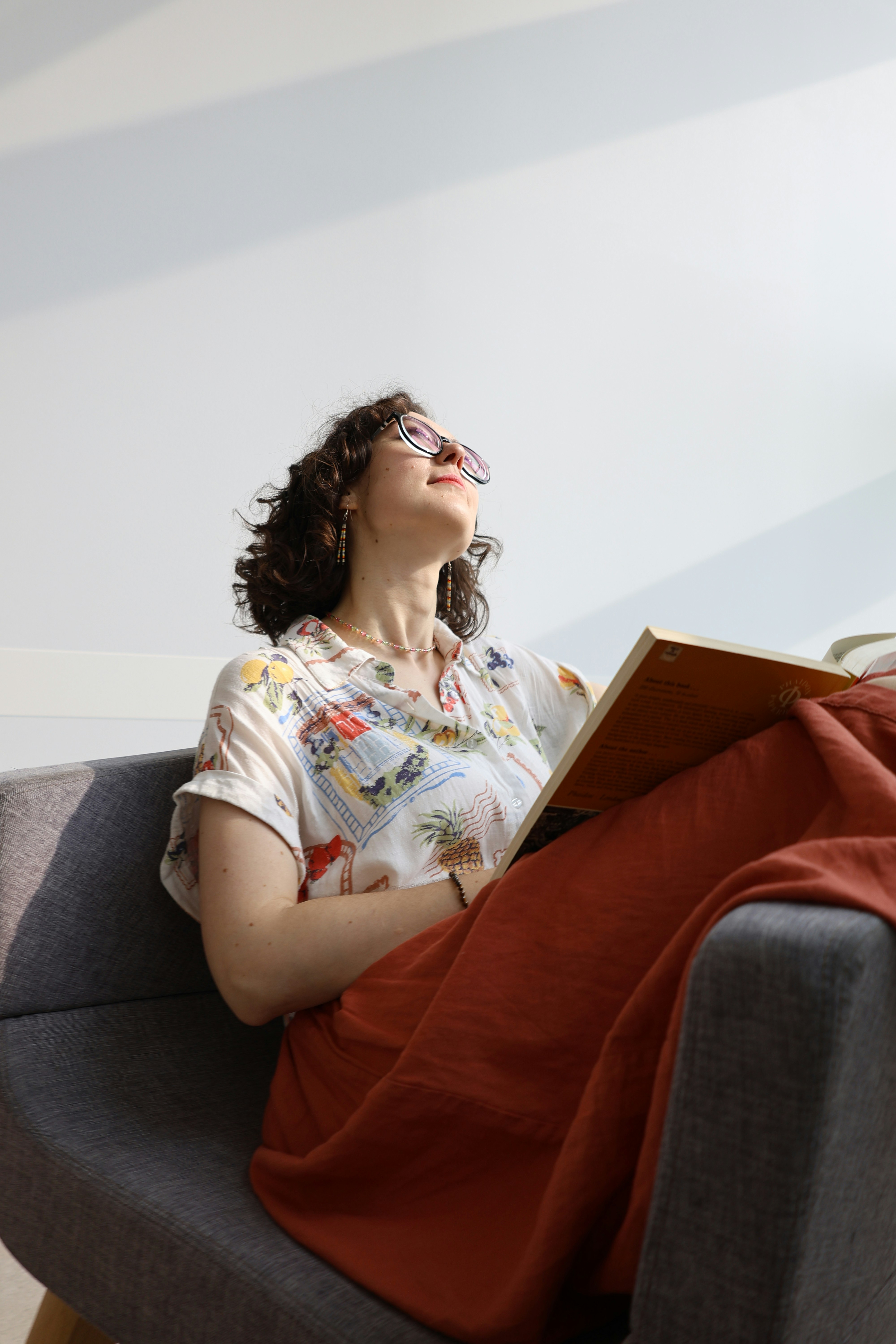 Woman reading a book in a chair