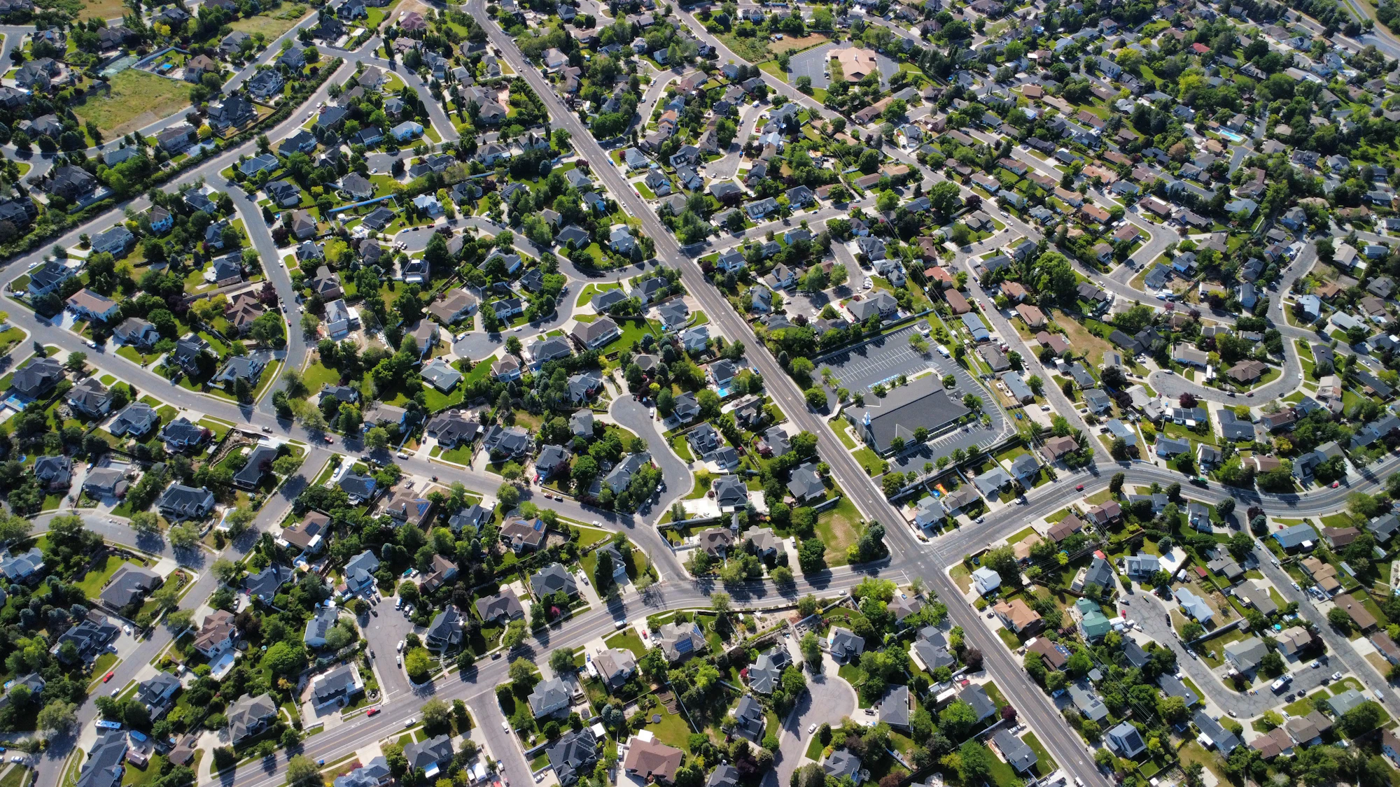An aerial view of tree-lined residential streets