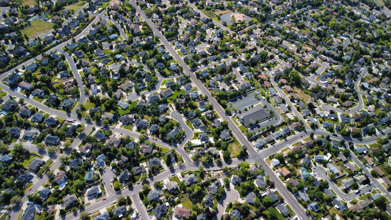 An overhead view of a residential grid, the order density and road network that decide how far a zone should reach