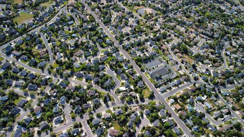 Aerial view of a suburban neighborhood with winding streets
