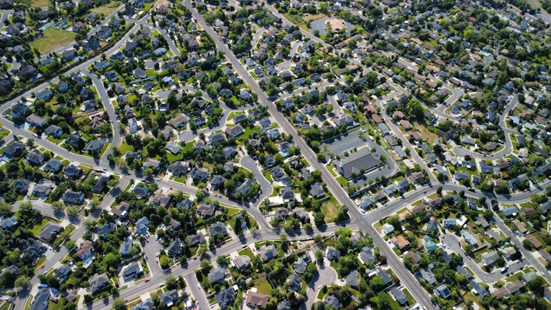 Aerial view of a suburban neighborhood with winding streets, similar to master-planned communities across the Las Vegas Valley