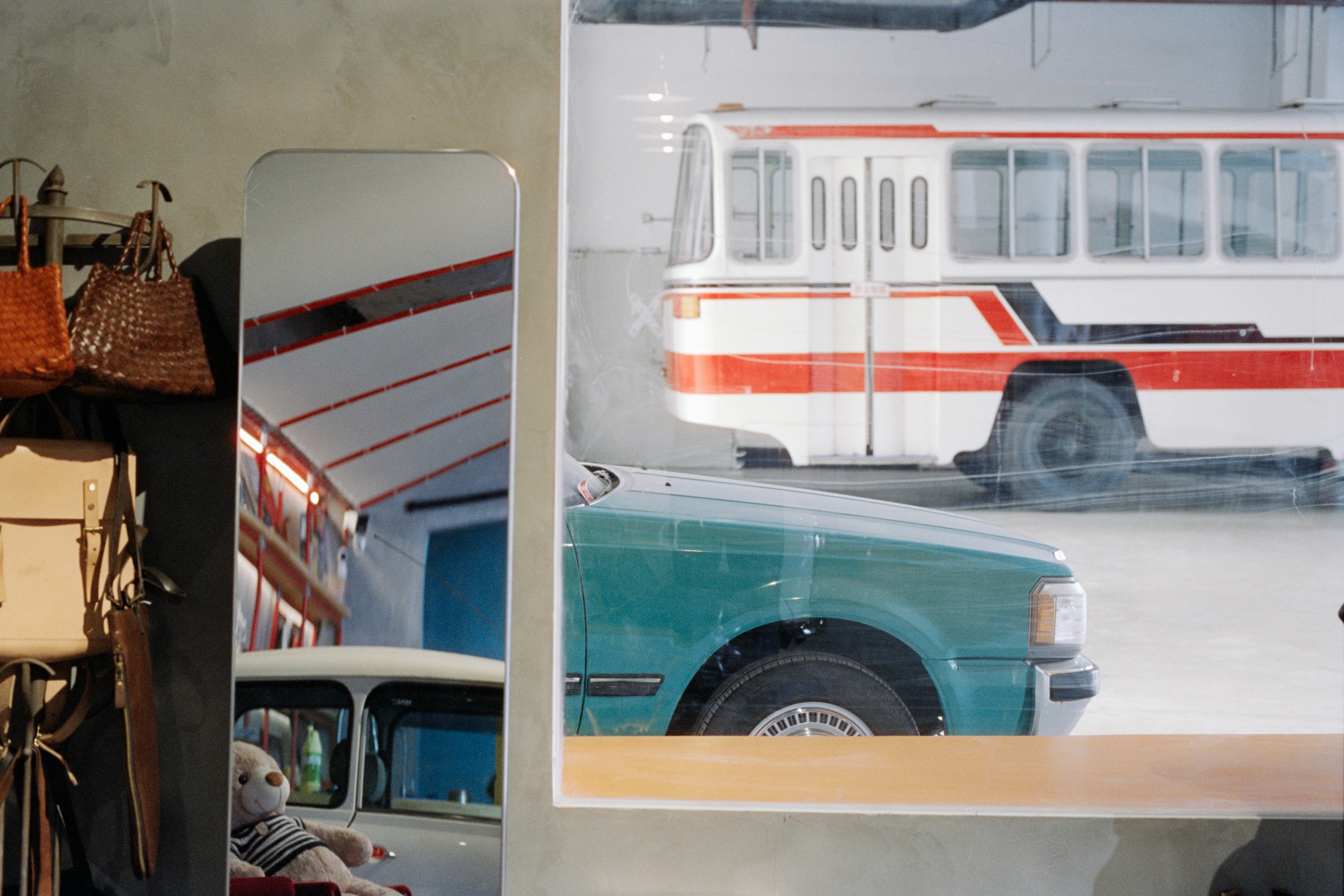Vintage bus and car reflected in a mirror