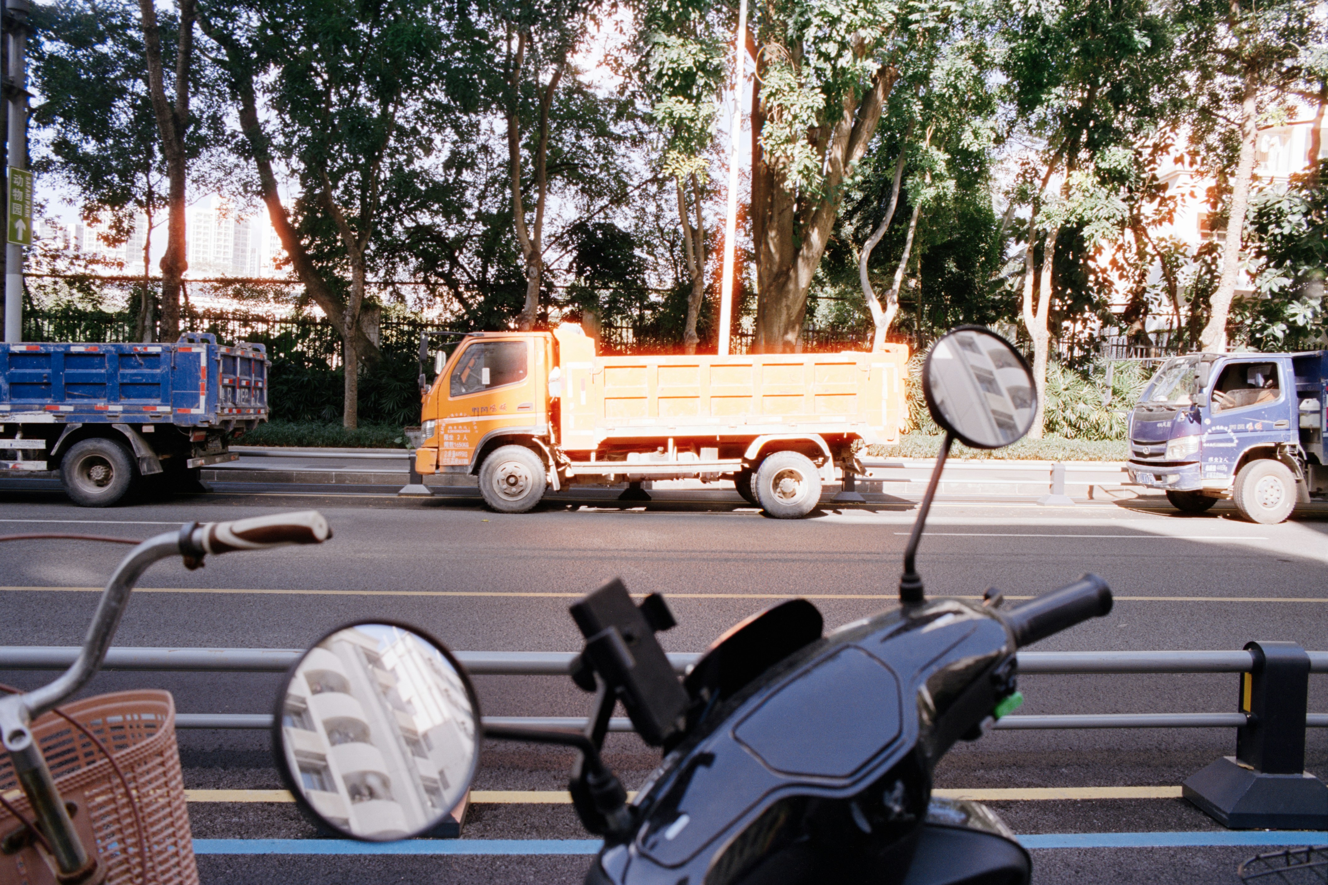 A heartbreaking image of a broken helmet lying on a road, with police tape in the background, symbolizing a recent accident.