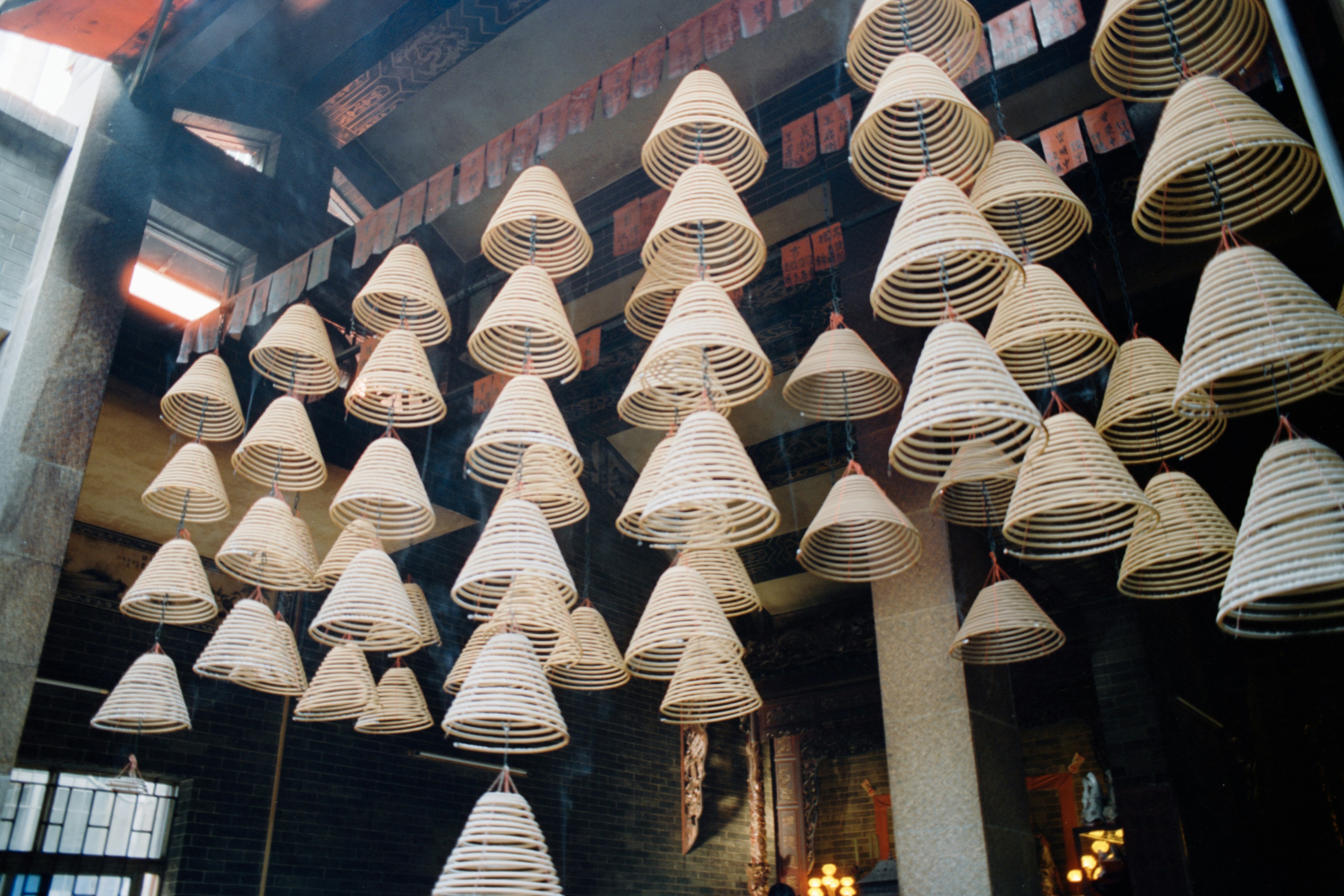 Many incense coils hanging from ceiling