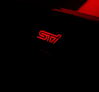 Red sti logo on black background