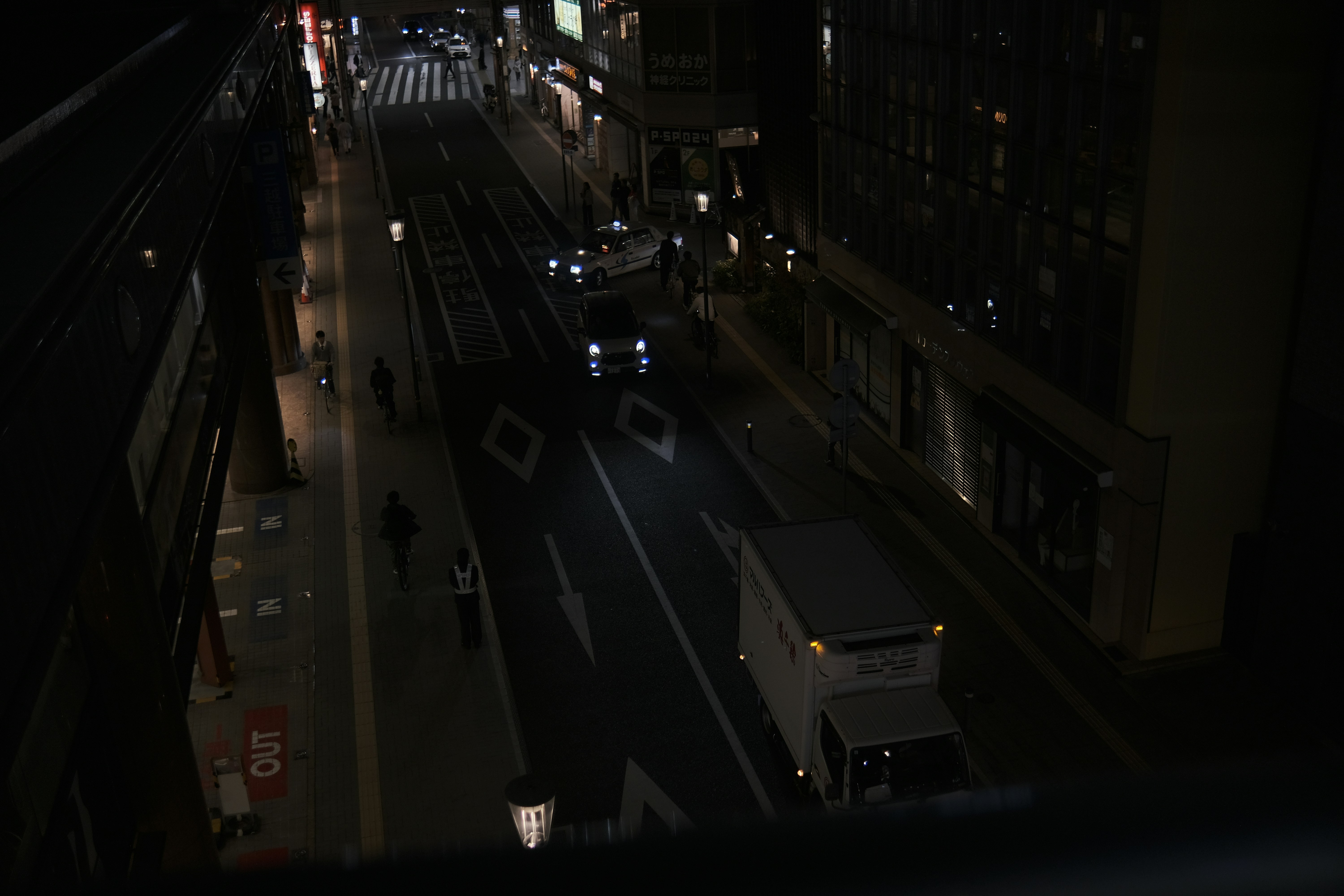 Night vision footage from a hidden car camera capturing a street scene