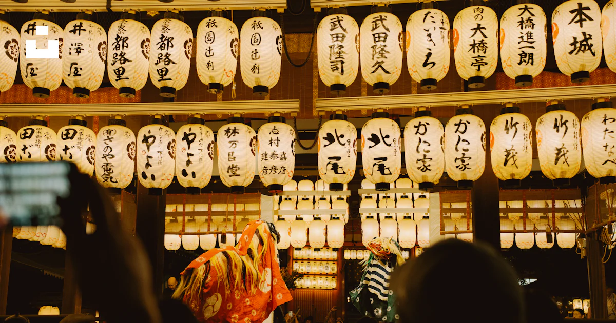 People watch a traditional performance under lanterns photo – Free ...