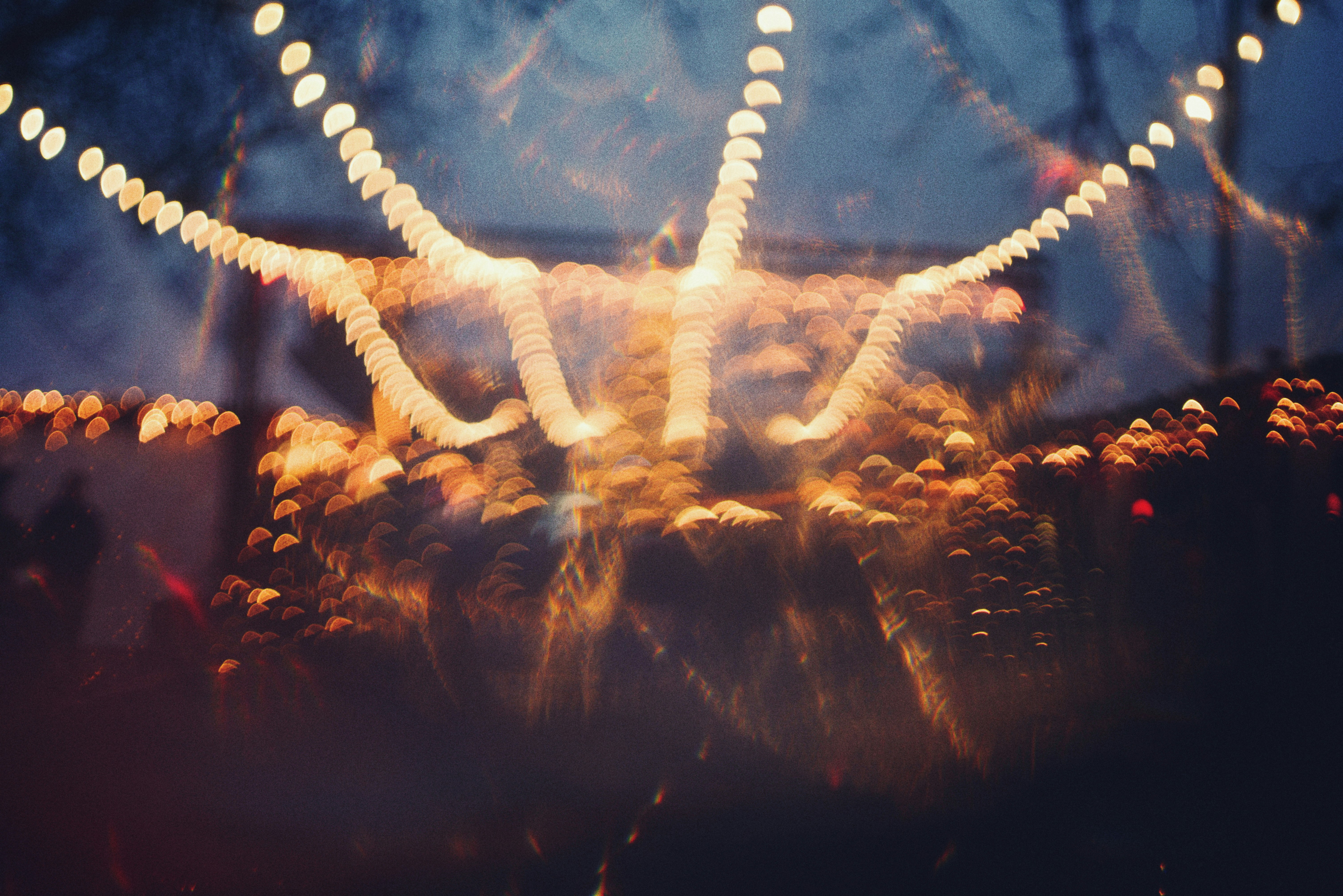 Blurred festive lights create abstract patterns at night.