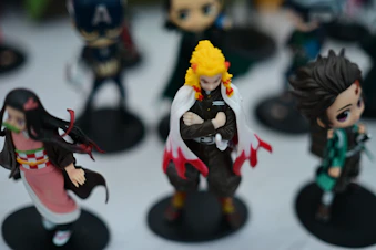 Anime figurines displayed on a white surface