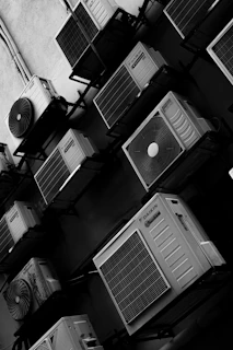 Multiple air conditioning units mounted on a wall